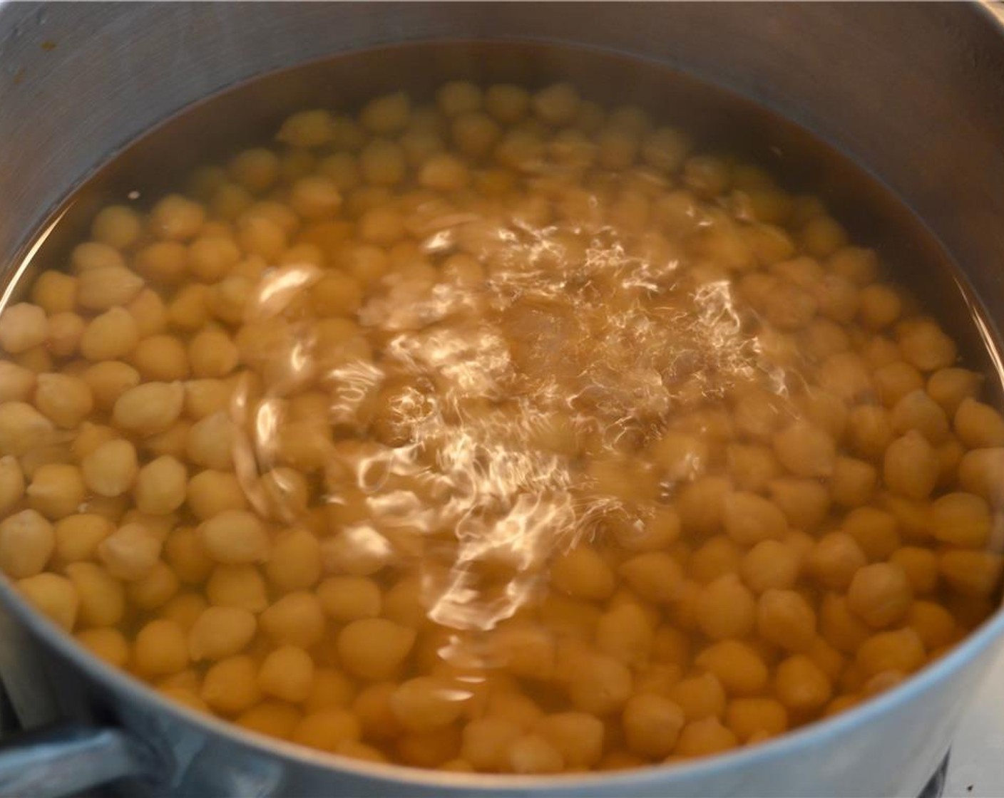 step 1 Start by getting the pre-soaked Dried Chickpeas (2 1/4 cups) simmering in a large pot of water. Ideally, you should use the cooking liquid to cook them. Make sure the lid stays on. Continue to simmer until very soft.