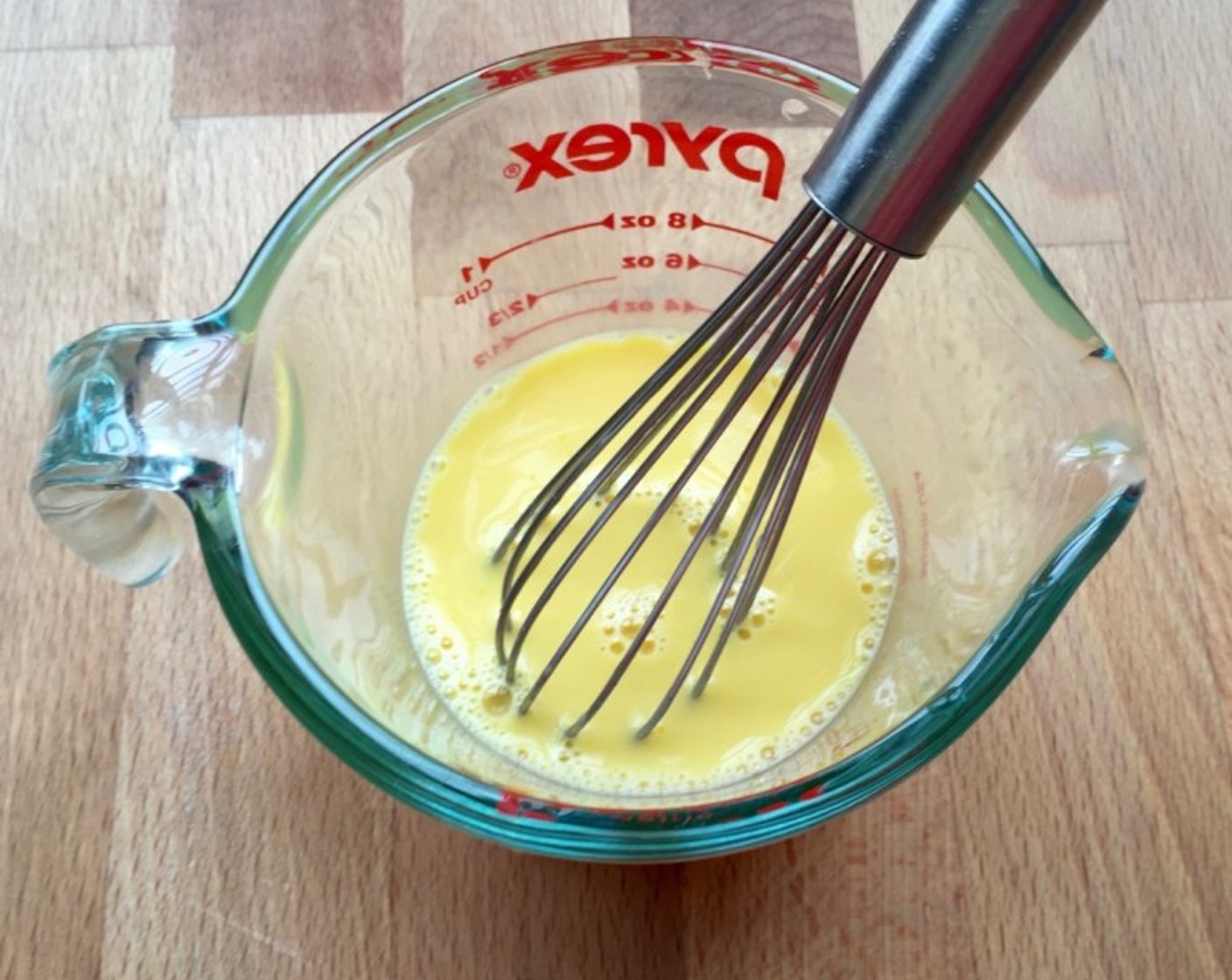step 9 Beat together 3/4 of the Egg Yolks, Water (3 Tbsp) and Vanilla Extract (1/2 tsp).