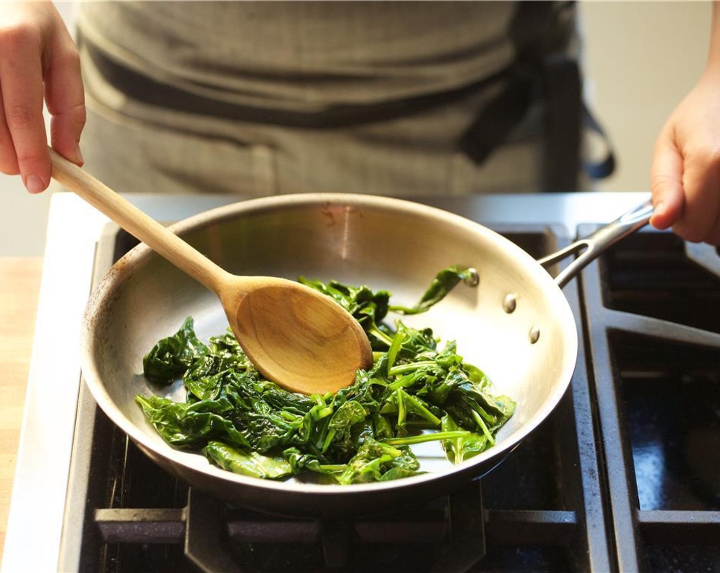 step 19 Meanwhile, in a second large saute pan over medium-high heat, add extra olive oil. When hot, add the Fresh Baby Spinach (4 3/4 cups) and Salt (1/4 tsp) and Ground Black Pepper (1/4 tsp).