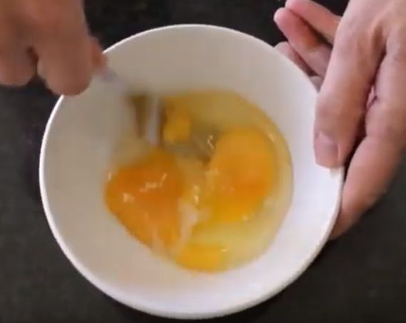 step 4 Crack Organic Eggs (2) into a separate bowl, season with salt and whisk until uniformly yellow.