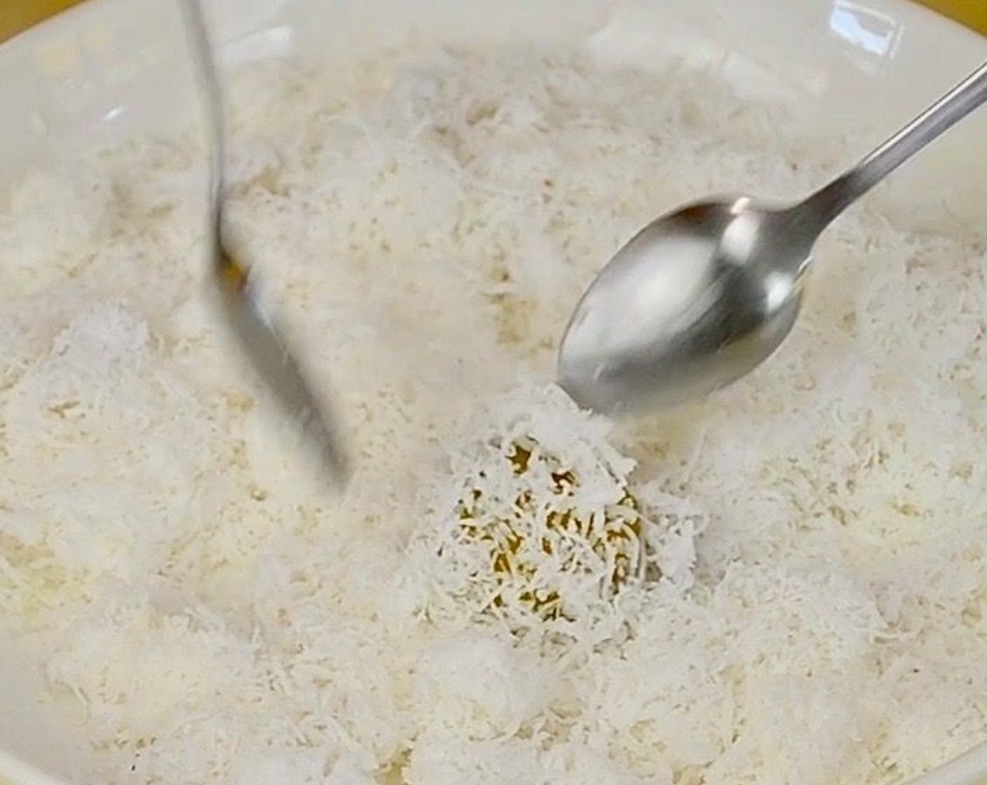 step 8 Roll and coat each cooked Onde Onde with the grated coconut.