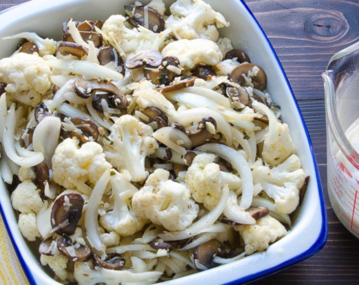 step 7 Add the mushrooms and Parmesan Cheese (1/4 cup) and toss to distribute the ingredients evenly. Transfer the vegetables into a small square or rectangular casserole dish, about 8" x 8".