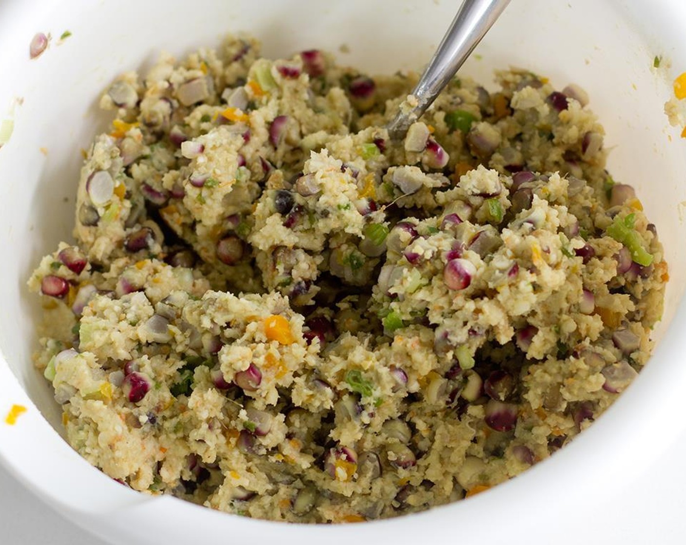 step 8 Once both the grits mixture and veggie mixture are cool enough to handle, combine together in a medium sized bowl.