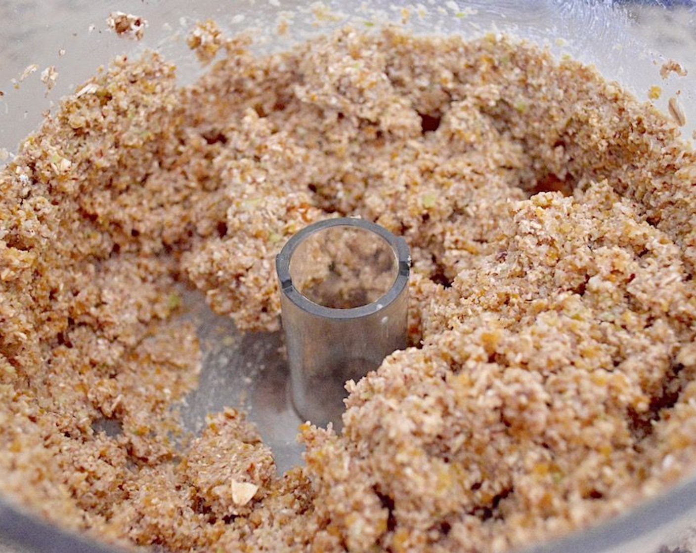 step 3 Combine the oats and pecans in the processor bowl with the Pears (2), Dried Apricots (1 1/2 cups), Dark Brown Sugar (1 Tbsp), Simply Organic Cinnamon, Ground (1 tsp), Mahlab Seeds (1/2 tsp), Flaxseeds (1/2 tsp) and Honey (1/2 tsp). Pulse it all together thoroughly until it is a sticky, uniform mixture.