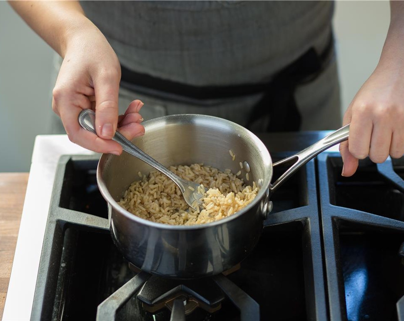 step 2 Over medium-high heat, bring 1 cup of water to a boil in a small sauce pot. Add the Brown Rice (2/3 cup) and stir. Cover and reduce heat to low. Simmer for 20 minutes. Remove from heat and fluff with a fork.