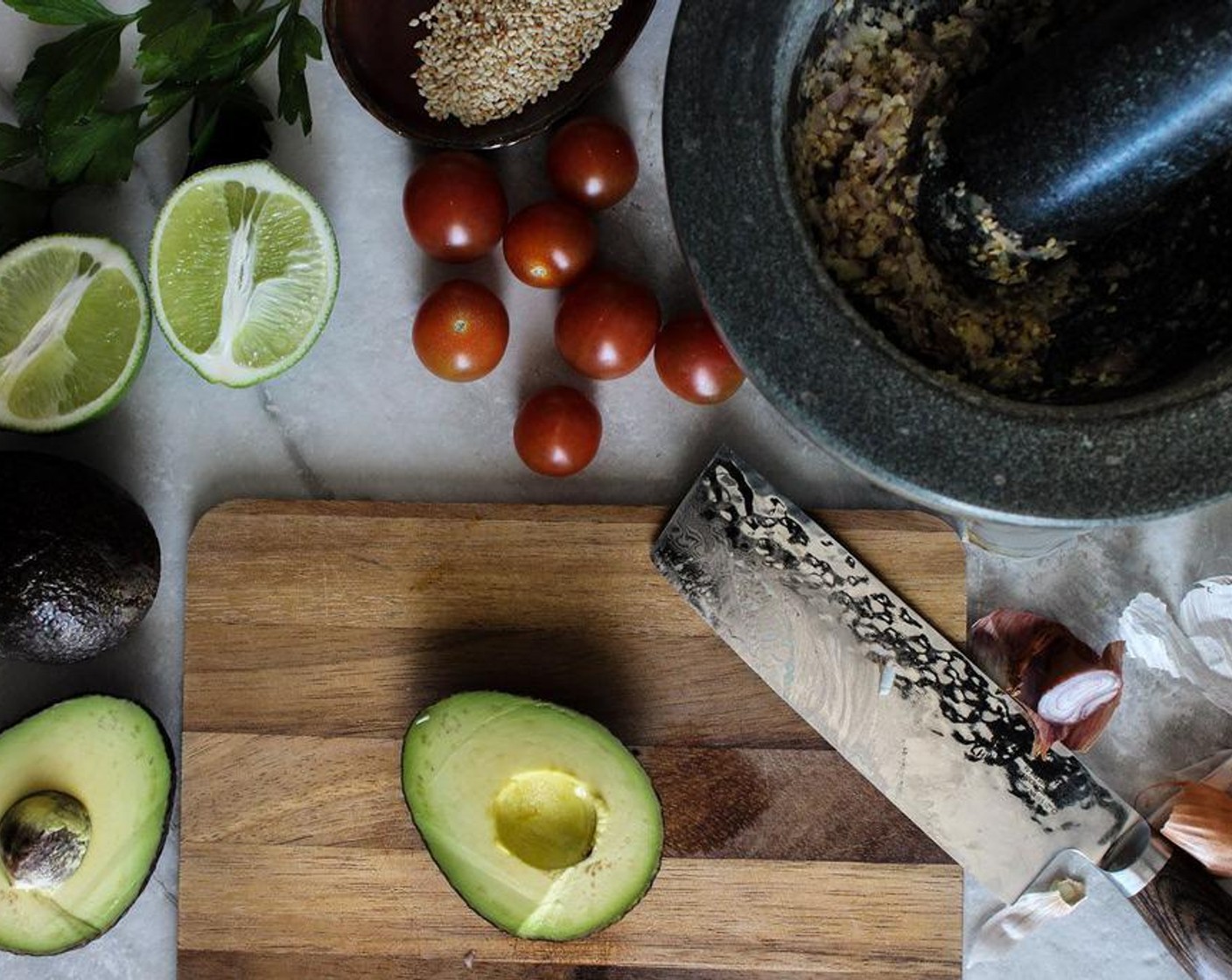 step 3 Cut the Avocados (2) in half and remove the pit. Scoop the avocado out of its skin, then mash it in the mortar and pestle to the consistency you like.