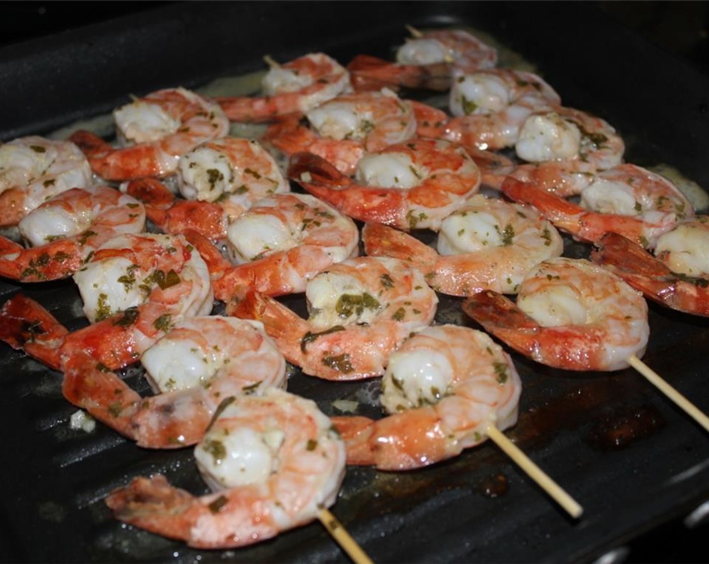 step 8 When your shrimp has finished marinating, remove your skewers from the fridge. Heat the grill/grill pan over high heat. When hot, add the shrimp skewers and cook for 1½-2 minutes on each side until the shrimp become pink and opaque.