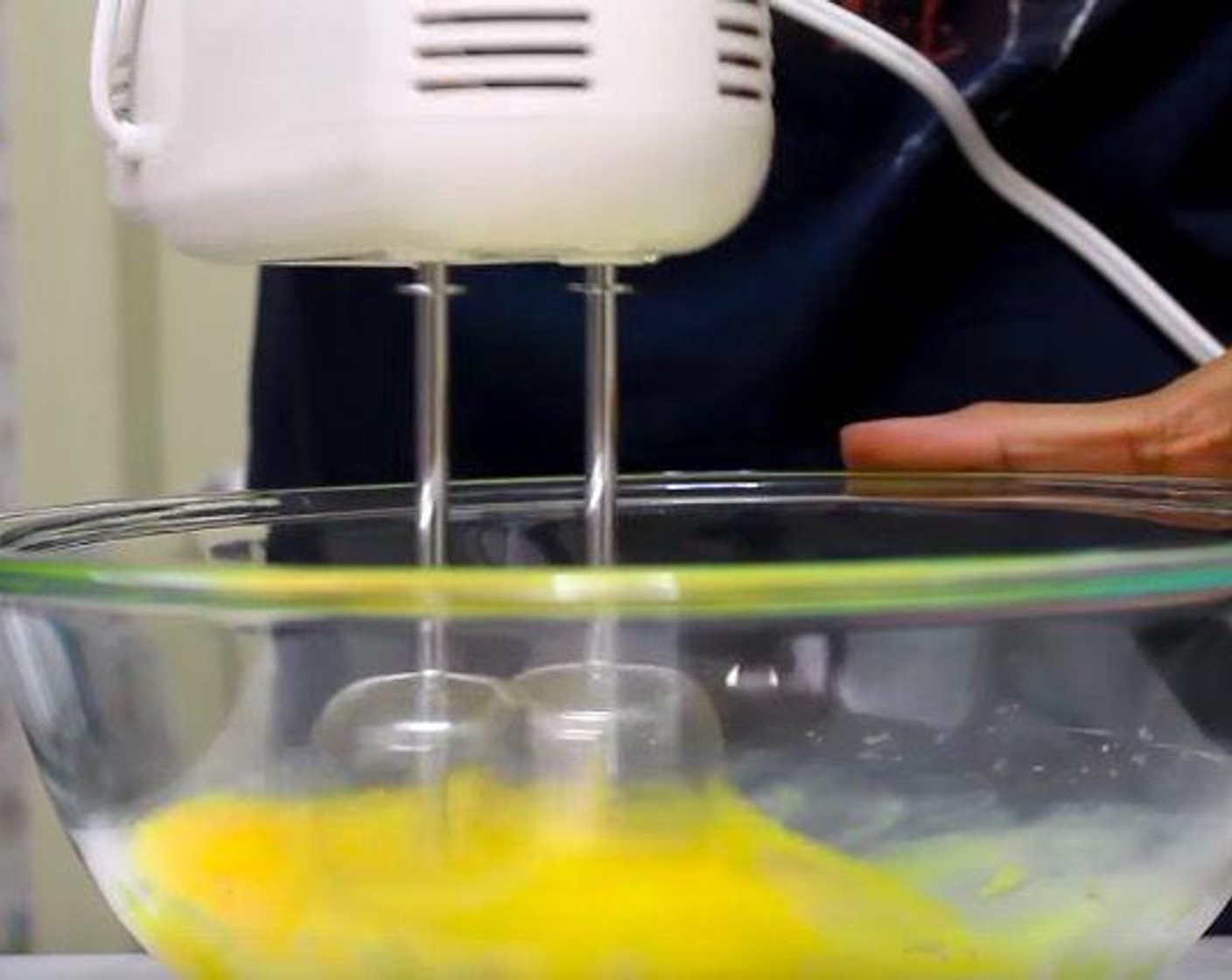 step 4 Using an electric mixer, beat the egg yolk and Eggs (2) in a bowl until doubled in volume, about 2 1/2 minutes.