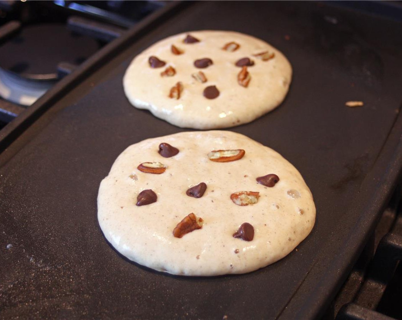 step 11 Sprinkle the tops of the pancakes with Vegan Chocolate Chips (1 Tbsp) and chopped pecans. About 5 chocolate chips and 1 pecan half per pancake.