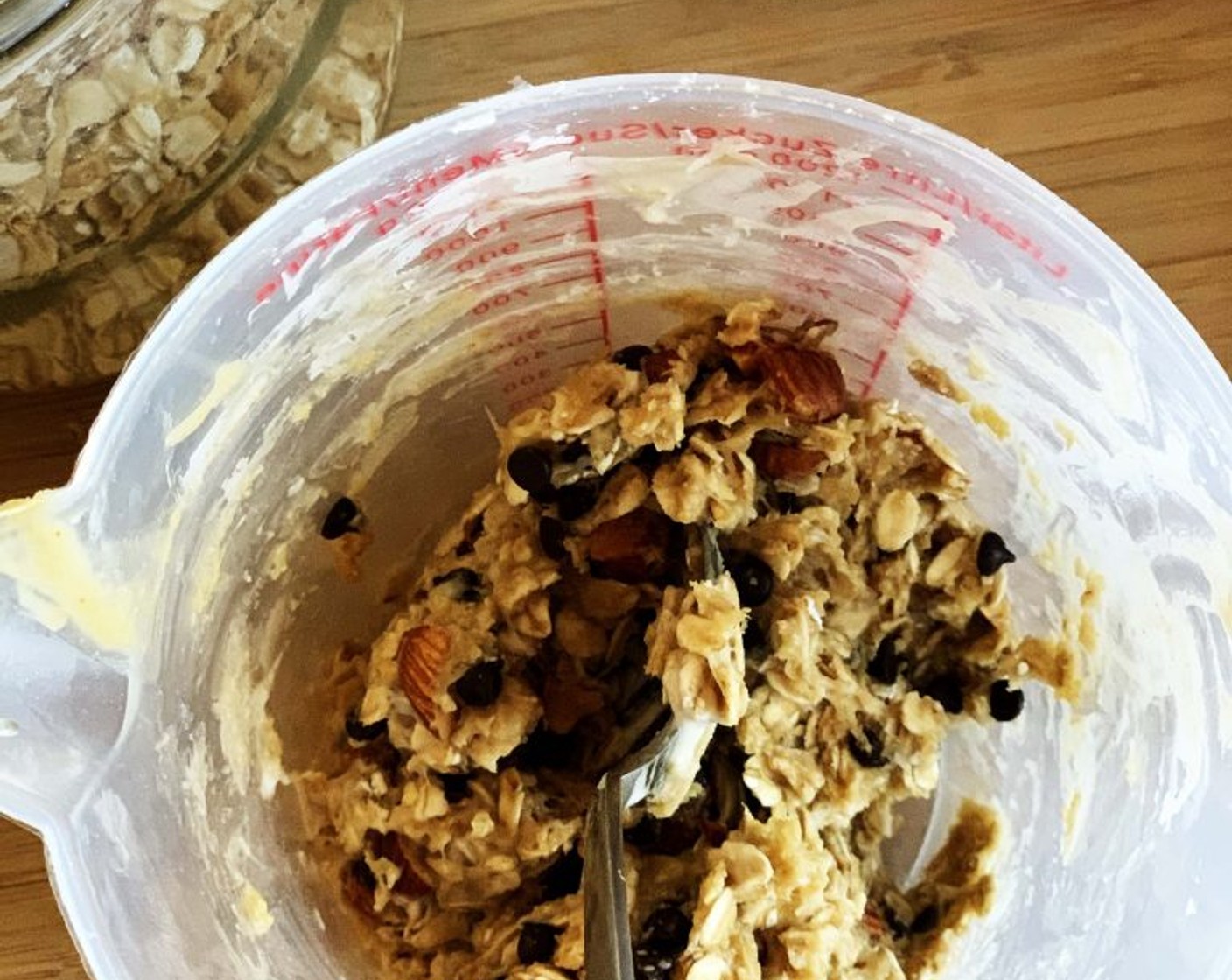 step 1 In a container mix the Sourdough Starters (2.5 oz), Old Fashioned Rolled Oats (3/4 cup), Natural Peanut Butter (3 Tbsp), Maple Syrup (1 Tbsp), Vegan Dark Chocolate Chips (1 2/3 Tbsp), and Chopped Roasted Almonds (2 1/2 Tbsp) together.