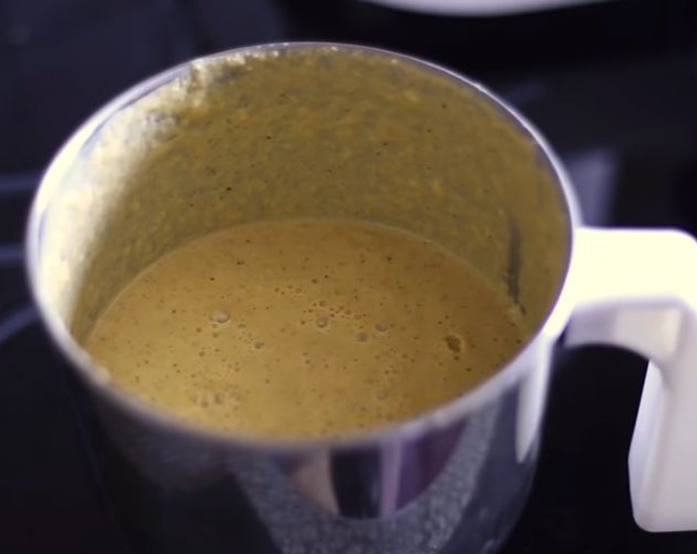 step 2 Meanwhile, in a blender jar place Green Chili Peppers (3), Tomato (1), Onion (1), Curry Leaves (2), Thick Yogurt (1 Tbsp), Ground Turmeric (1/2 tsp), Ground Coriander (2 tsp), and some Salt (to taste). Blend to a fine paste.