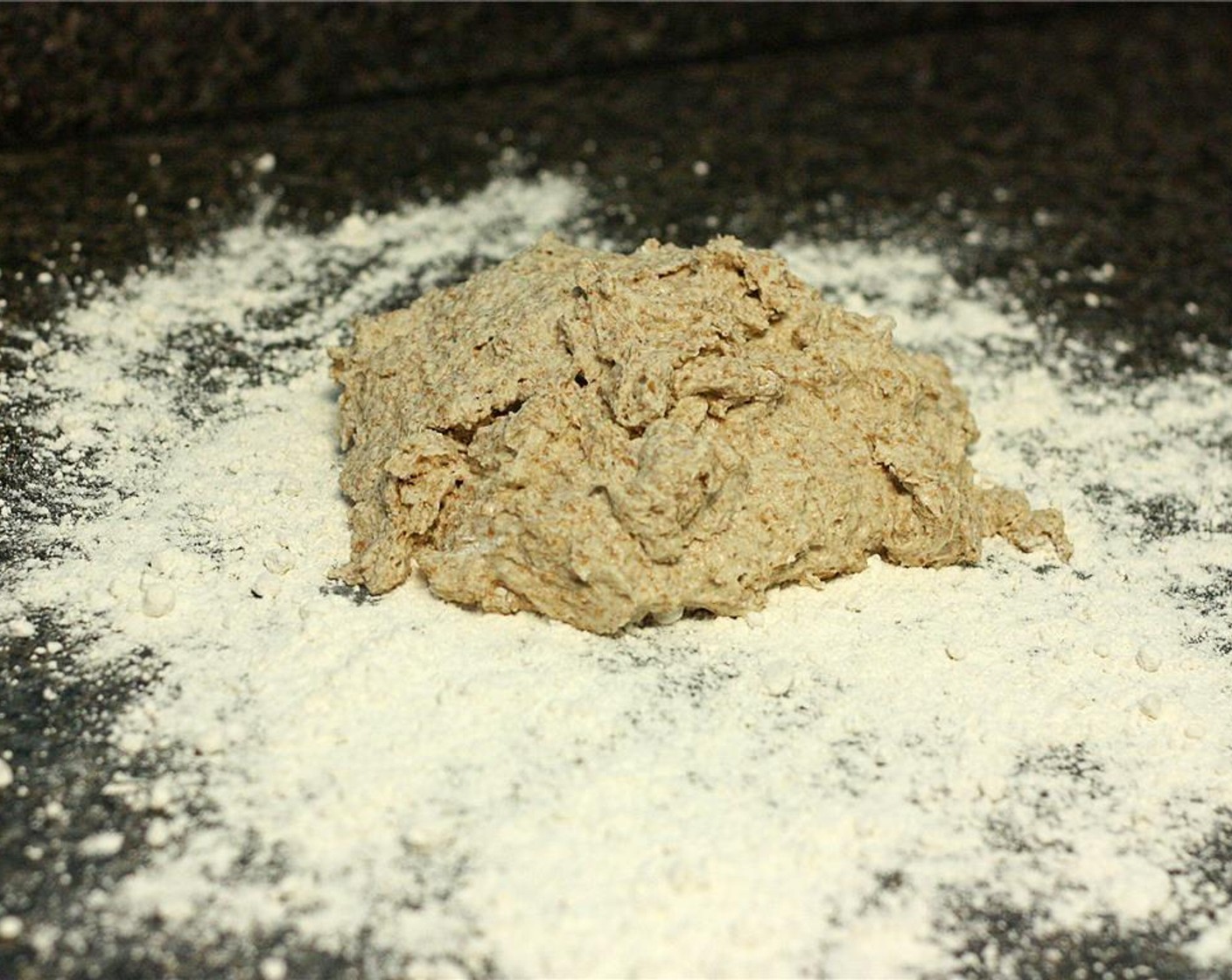 step 3 Empty the bowl onto a well-floured surface and knead for 5 to 10 minutes, adding more flour as needed to create a smooth, firm ball of dough.