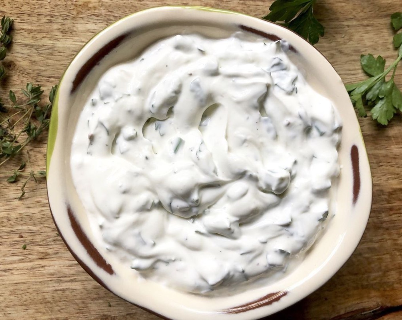 step 8 While potatoes are baking, make the optional sour cream. Place the Sour Cream (1 cup) in a small bowl. Add the Fresh Herbs (2 Tbsp), McCormick® Garlic Powder (1/4 tsp),Salt (to taste), Freshly Ground Black Pepper (to taste) and juice from Lemon (1). Stir well to combine.