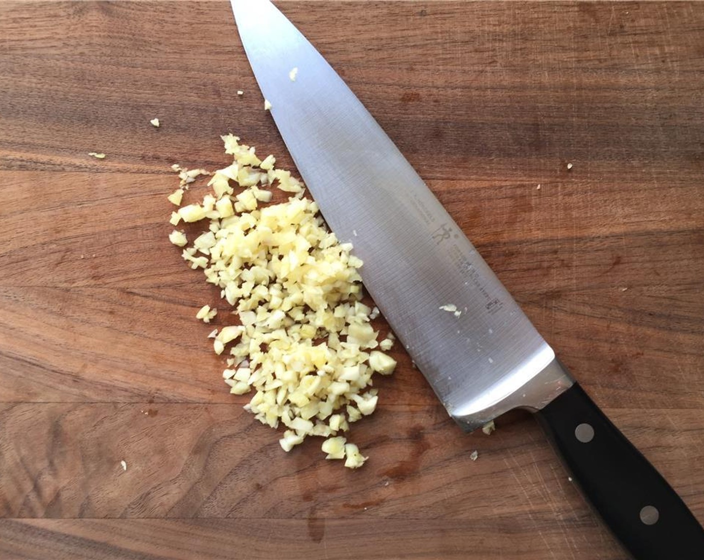 step 7 As the onions caramelize, mince the Garlic (6 cloves).