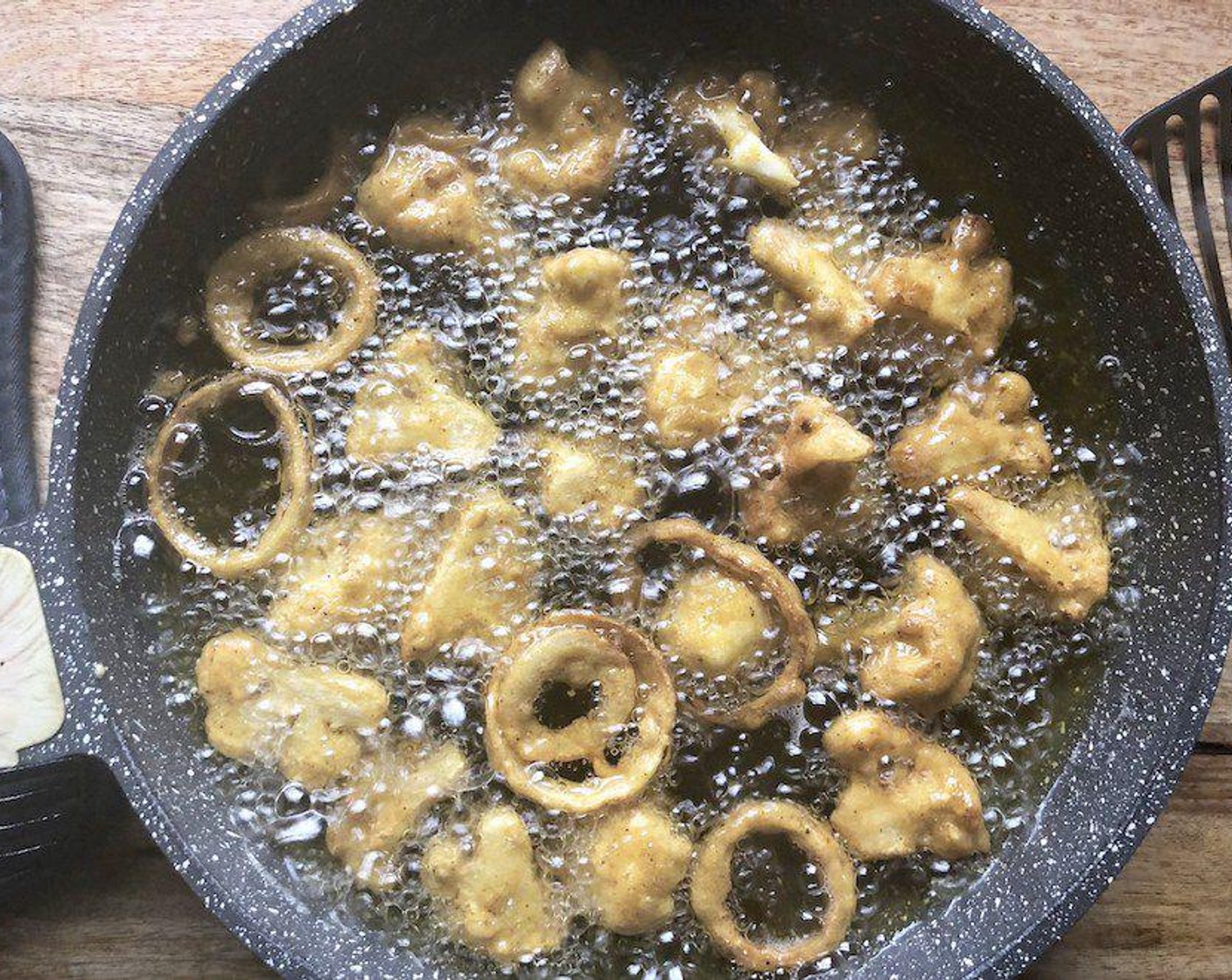 step 4 Pour the Vegetable Oil (as needed) into a large, heavy skillet. Heat until an instant-read thermometer registers 375 degrees F (190 degrees C).