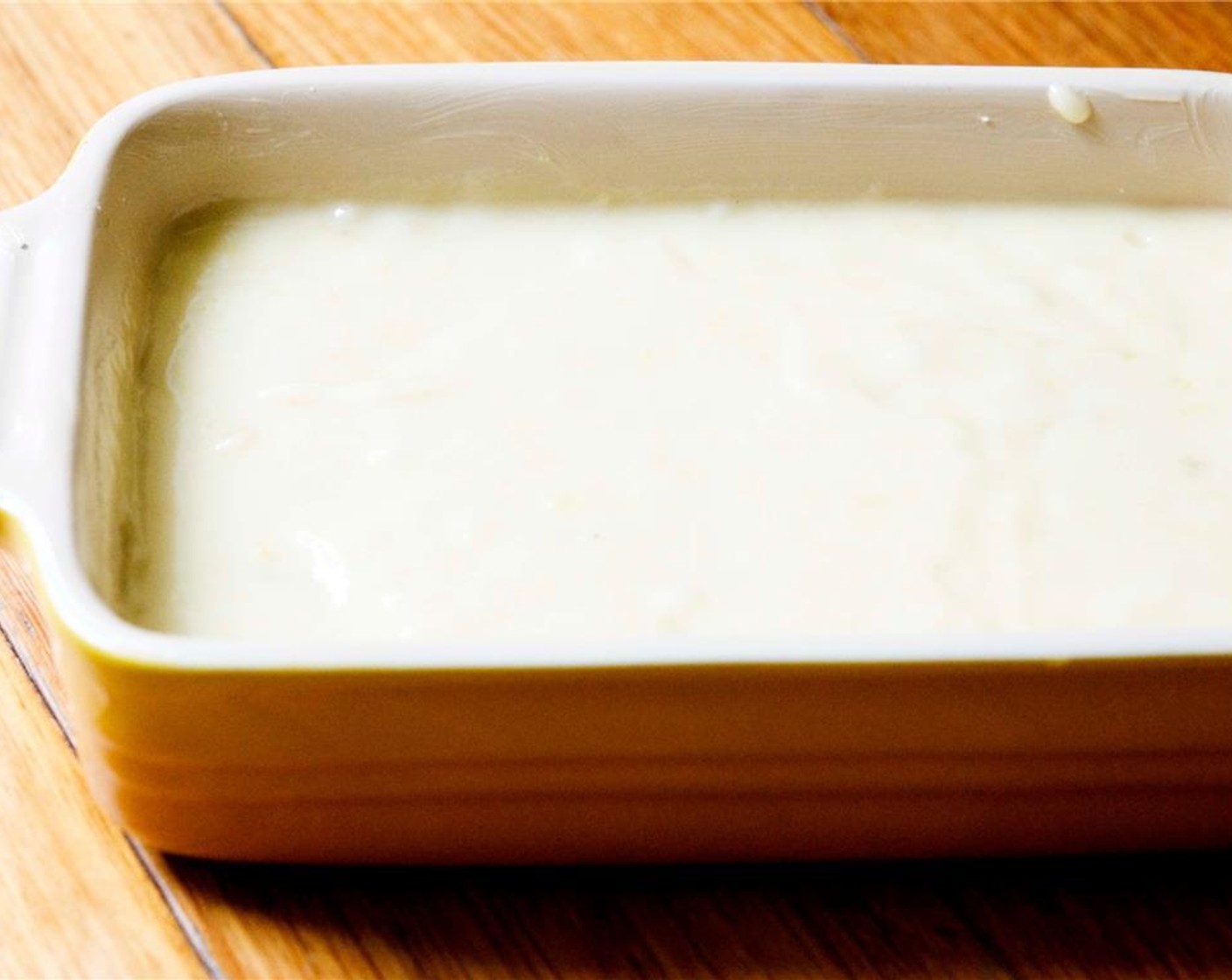 step 4 Pour mixture into a buttered baking dish, and spread into an even layer.