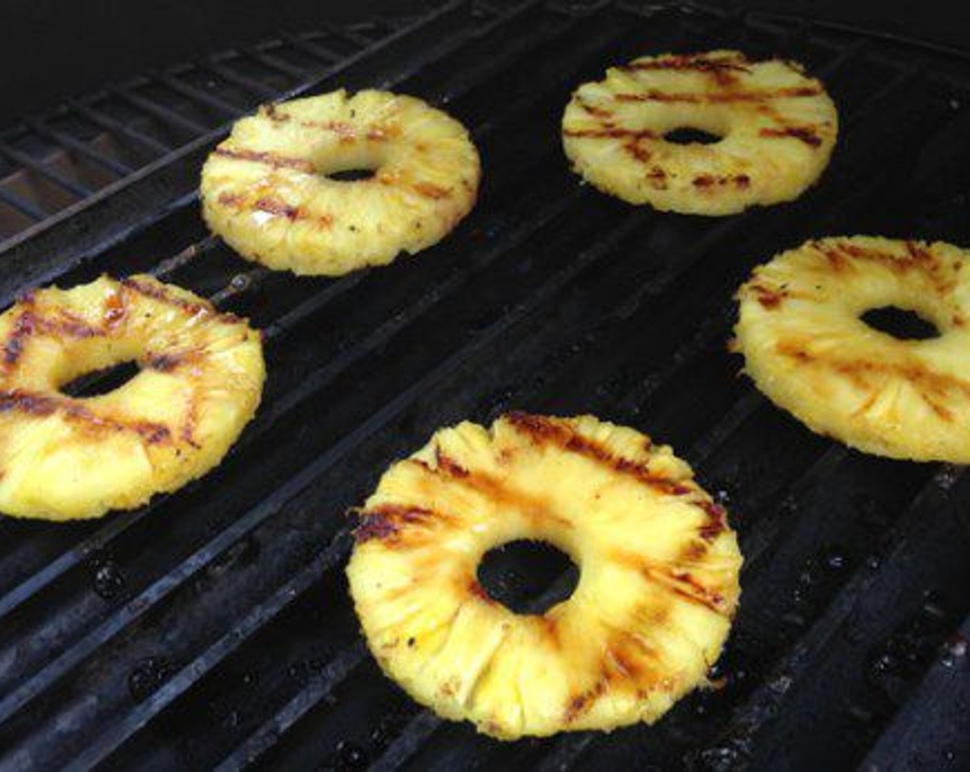 step 7 While they’re resting it’s time to grill the Pineapple Rings (1). Sprinkle each side with a little Brown Sugar (1/4 cup) and place on the grill. It only takes about 1 ½ minutes per side