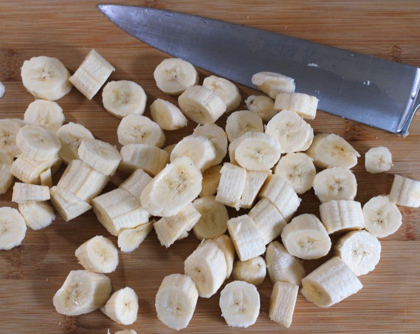 step 1 Peel Bananas (5) and cut into 1/2-inch pieces.
