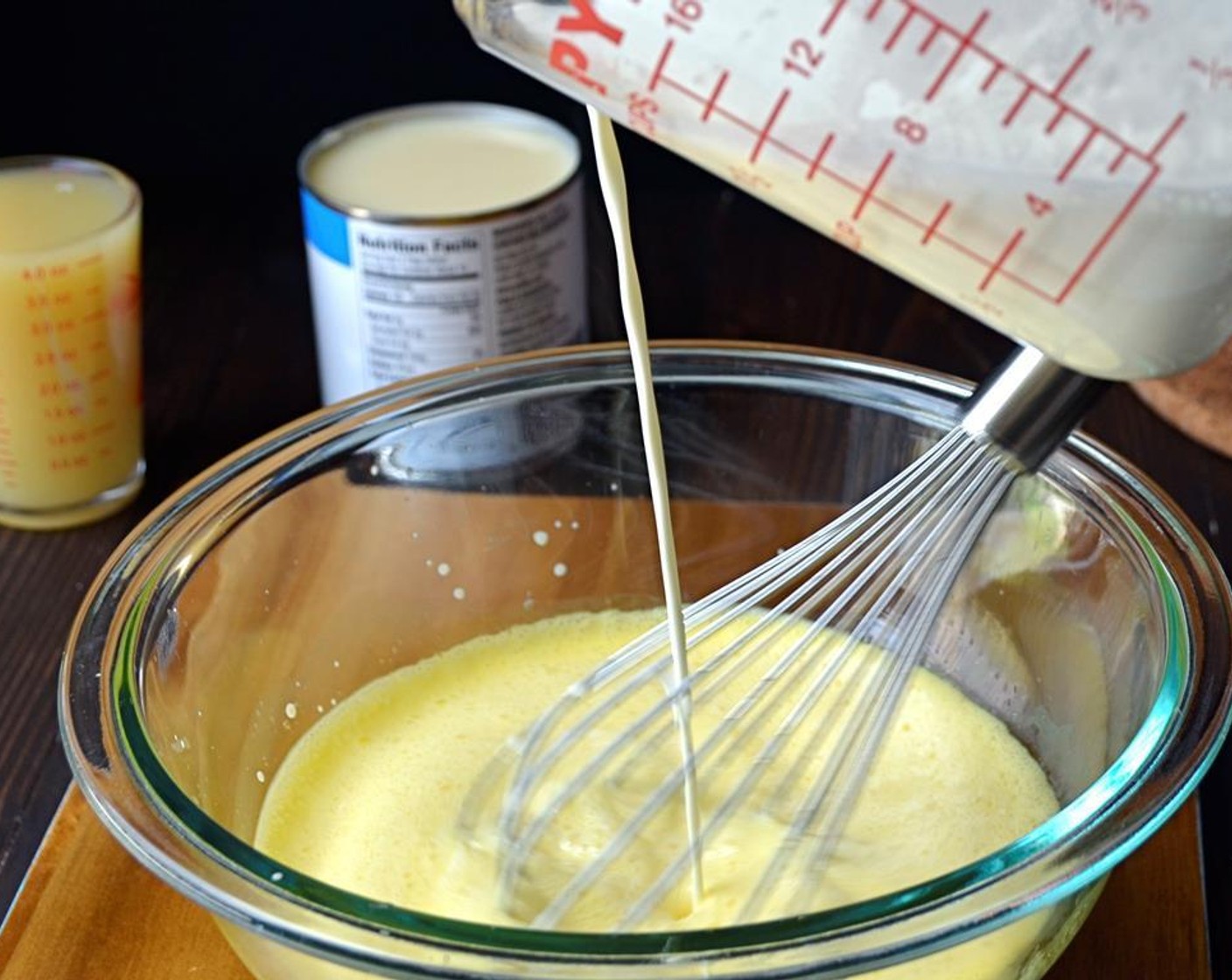 step 5 Bring the Heavy Cream (1 1/2 cups) to a simmer in a heavy medium-sized saucepan. When cream is hot, slowly whisk it into the egg yolks -- adding the cream a little at a time so that the eggs don't heat too quickly and scramble.