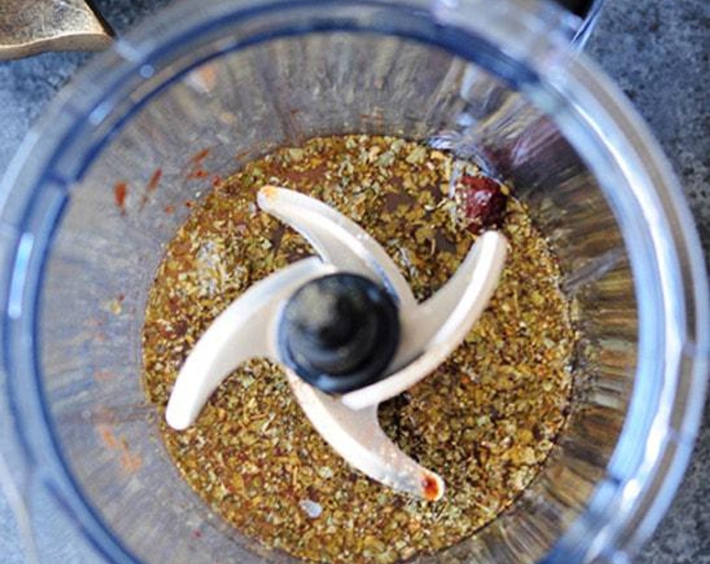 step 2 Place Chipotle Peppers in Adobo Sauce (3), Garlic (4 cloves), Beef Broth (1 cup), Ground Cumin (1 1/2 Tbsp), Dried Oregano (1 Tbsp), Salt (2 tsp), Ground Black Pepper (1/2 tsp), Ground Cloves (1/4 tsp), and the juice from Limes (2) in a food processor. Pulse until blended.