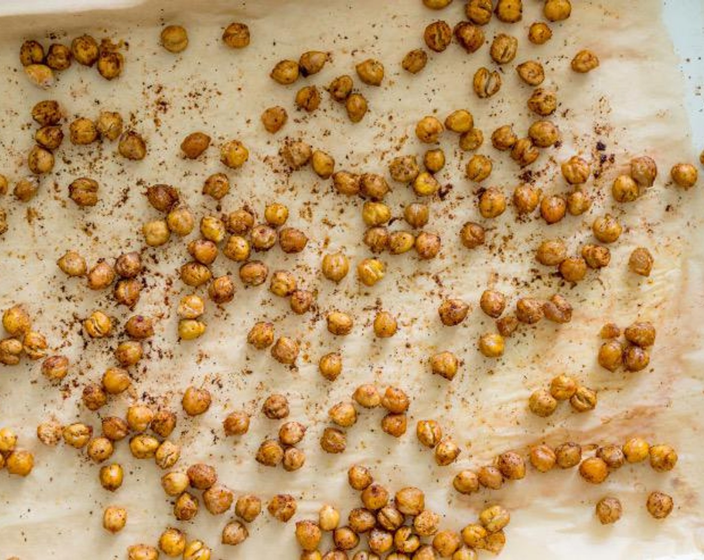 step 4 Evenly spread chickpeas across parchment covered baking sheet. Bake for 20-30 minutes or until crunchy and crispy.