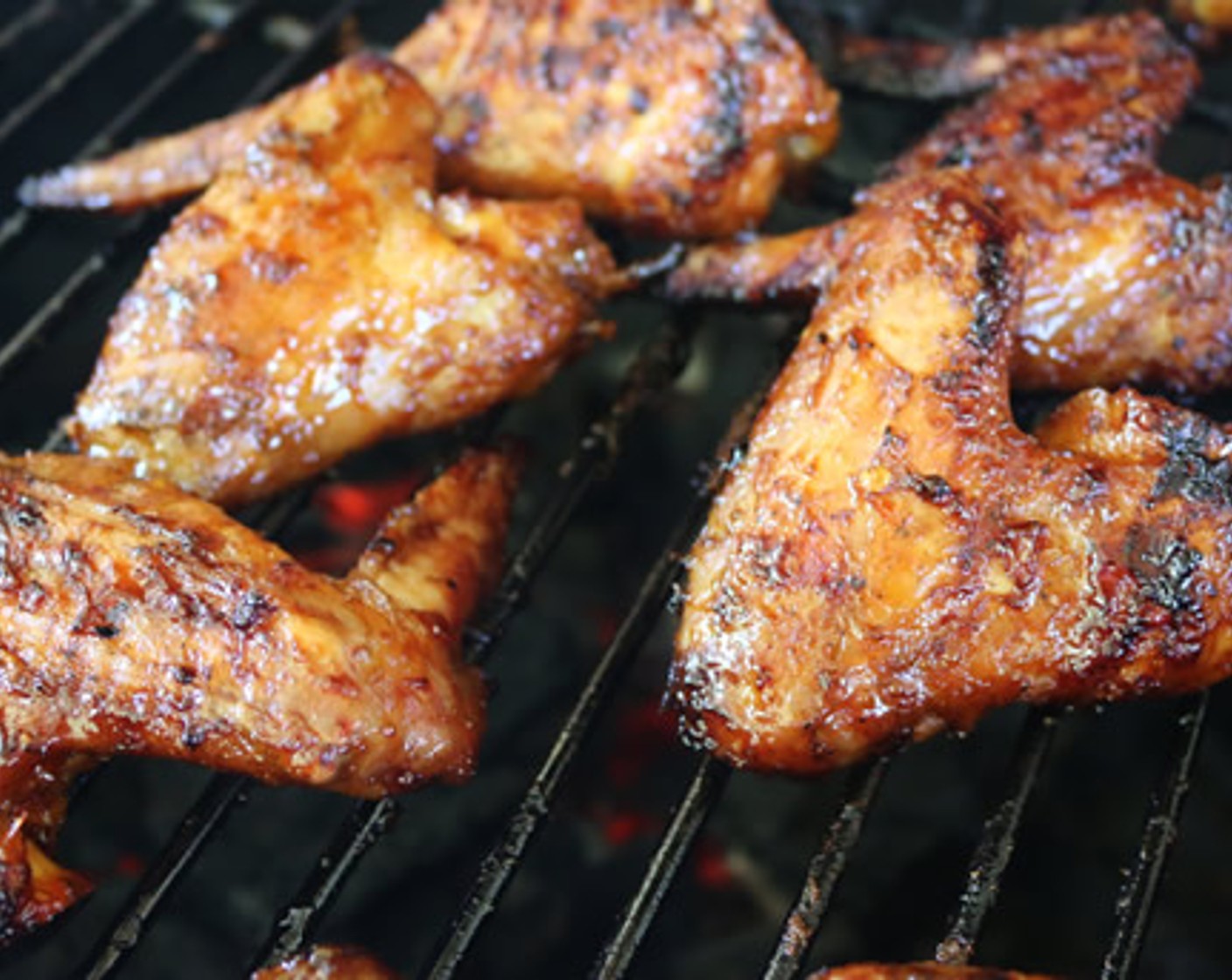 step 9 After wings have cooked for 25-30 minutes, dunk each wing in the sauce and return to grill.