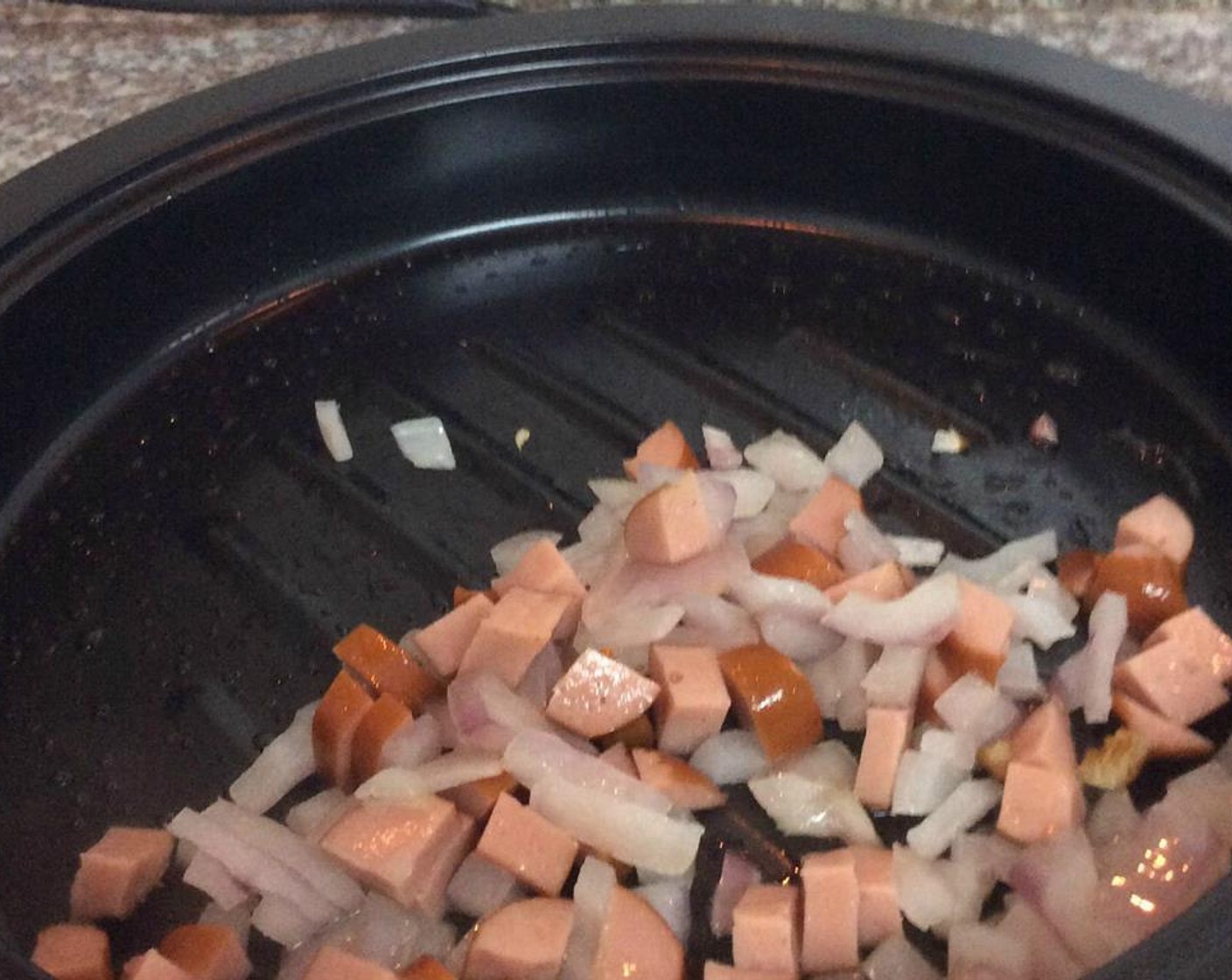step 4 Add Oil (as needed) to the pan over medium heat. When hot, add the chopped onion and sausage.