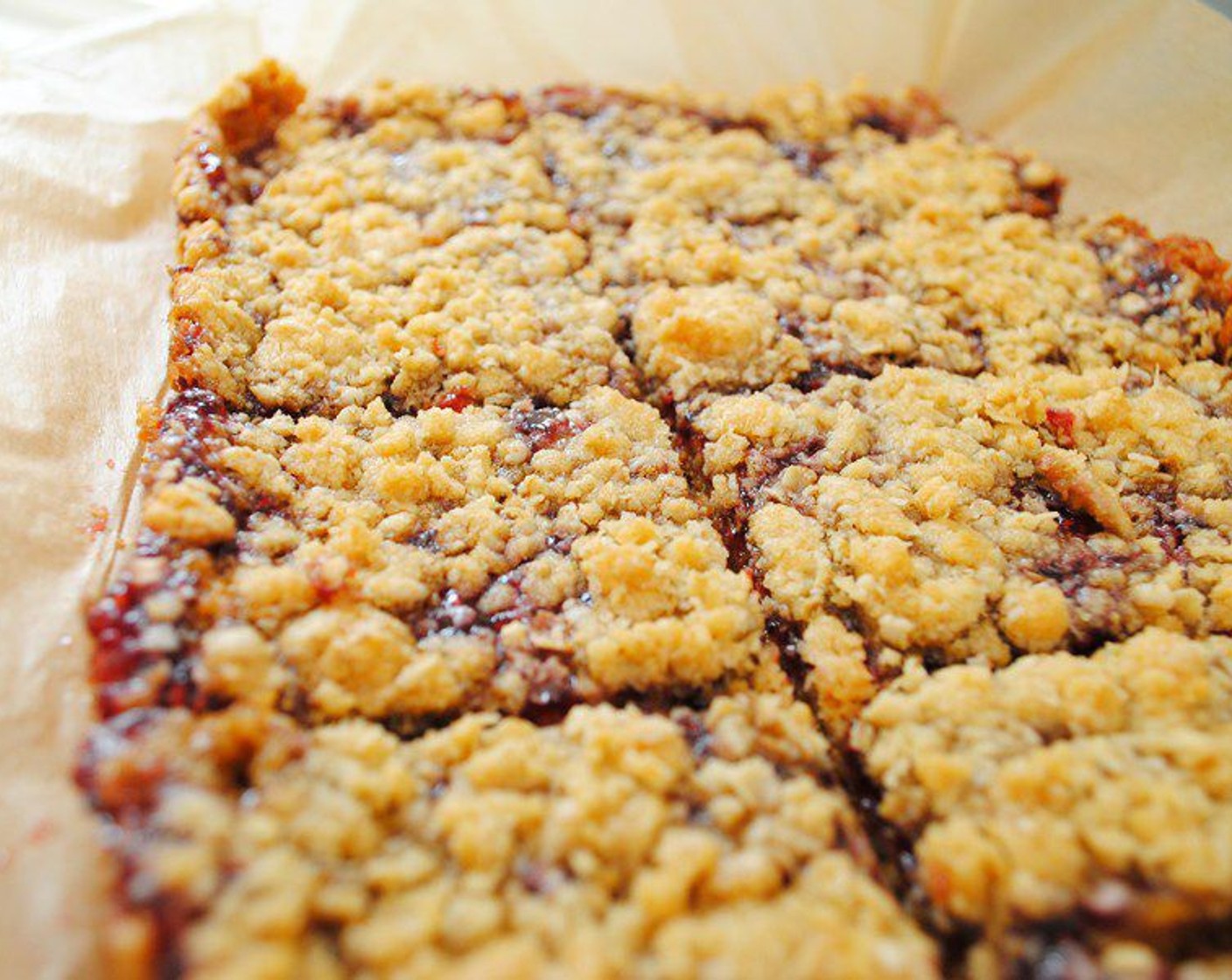 step 7 Spread Raspberry Preserves (1/2 cup) on top, and sprinkle with the remaining 1/2 cup crumbs. Bake for 15-18 Minutes, until the top is nice and evenly brown.