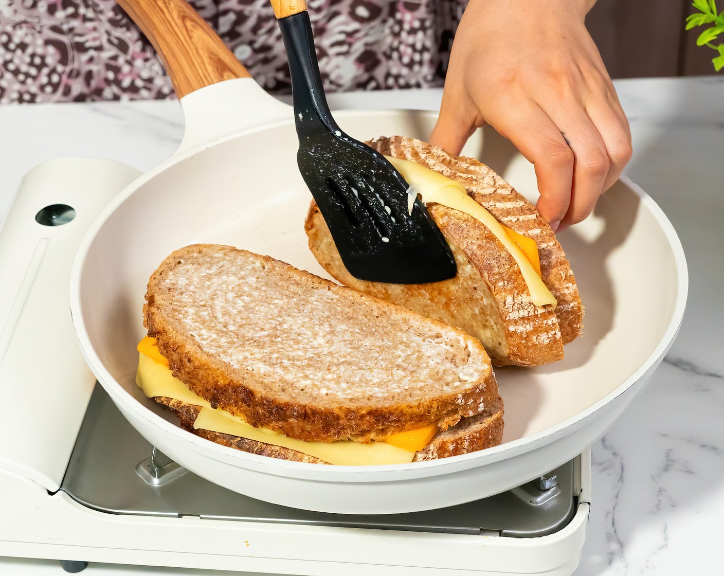 step 3 Place the second piece of bread on top of each sandwich, mayo side out. Press down lightly. Carefully flip the sandwiches and cook for 3-4 more minutes, until the bottom is golden brown. The cheese should be fully melted by now.