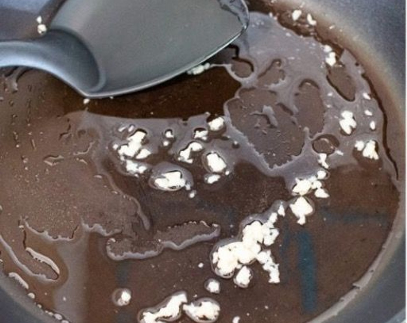 step 1 Heat the Olive Oil (1 Tbsp) in a large, non-stick frying pan. Add the Garlic (1 clove) and fry for 1 minute, until it turns slightly golden in color.