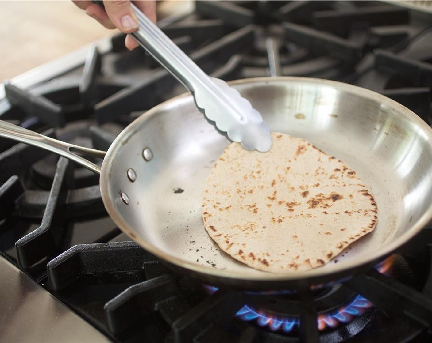 step 9 Heat a medium saute pan over high heat and add the Whole Wheat Tortillas (4) one at a time. Cook each side for 15 seconds until very hot.