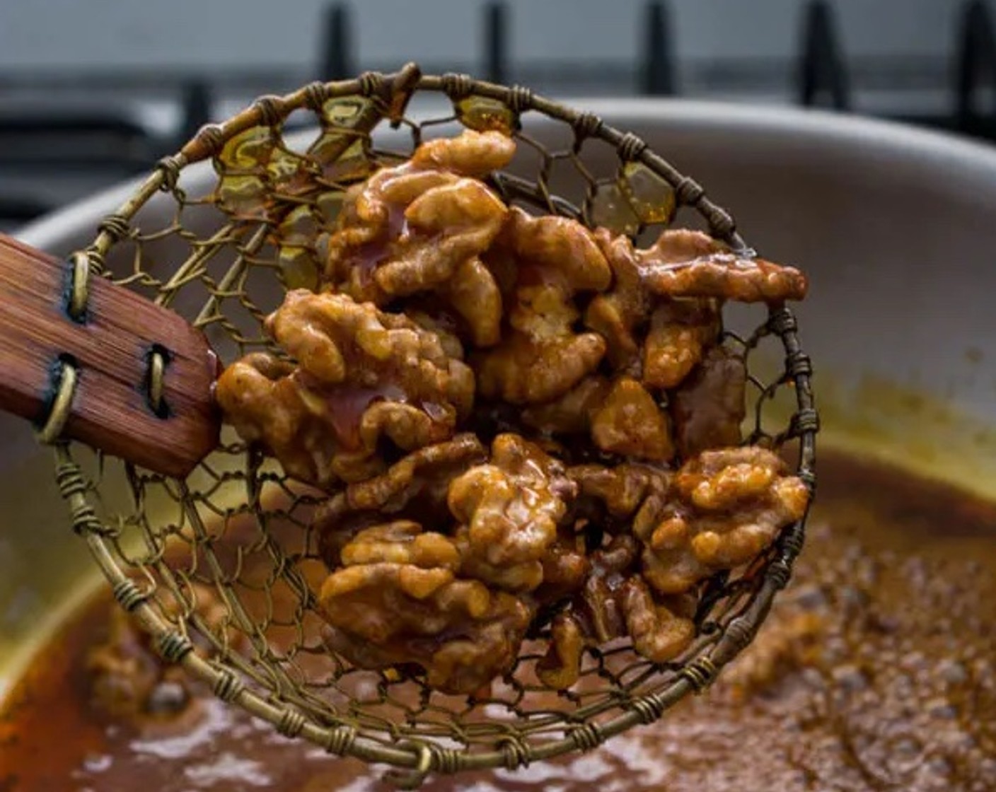 step 2 When the caramel turns into a nice golden brown color, add Walnut Pieces (1/2 cup) to the saucepan. Stir for about 15-20 seconds, and remove the walnuts from the saucepan with a spider skimmer.