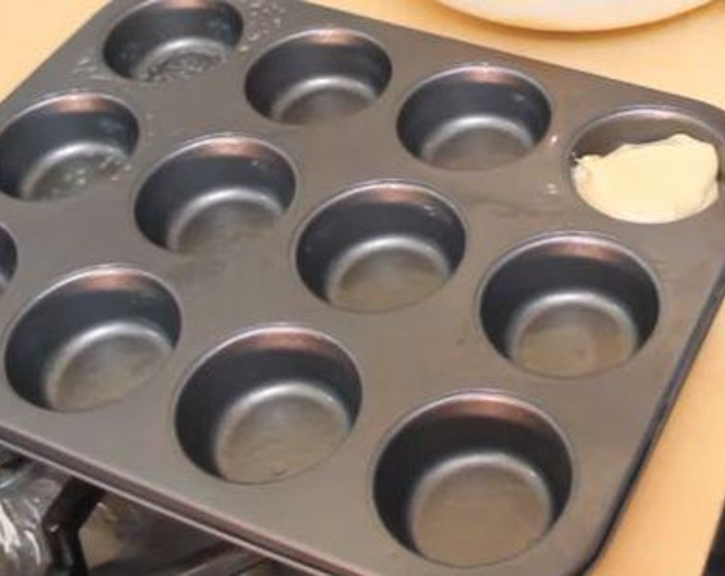 step 3 Stir in the Milk (1/2 cup) and pour the batter 3/4 high into the cups of a greased muffin tin. Bake the cupcakes at 350 degrees F (180 degrees C) for 18-20 minutes or until a toothpick inserted in the center comes out clean.