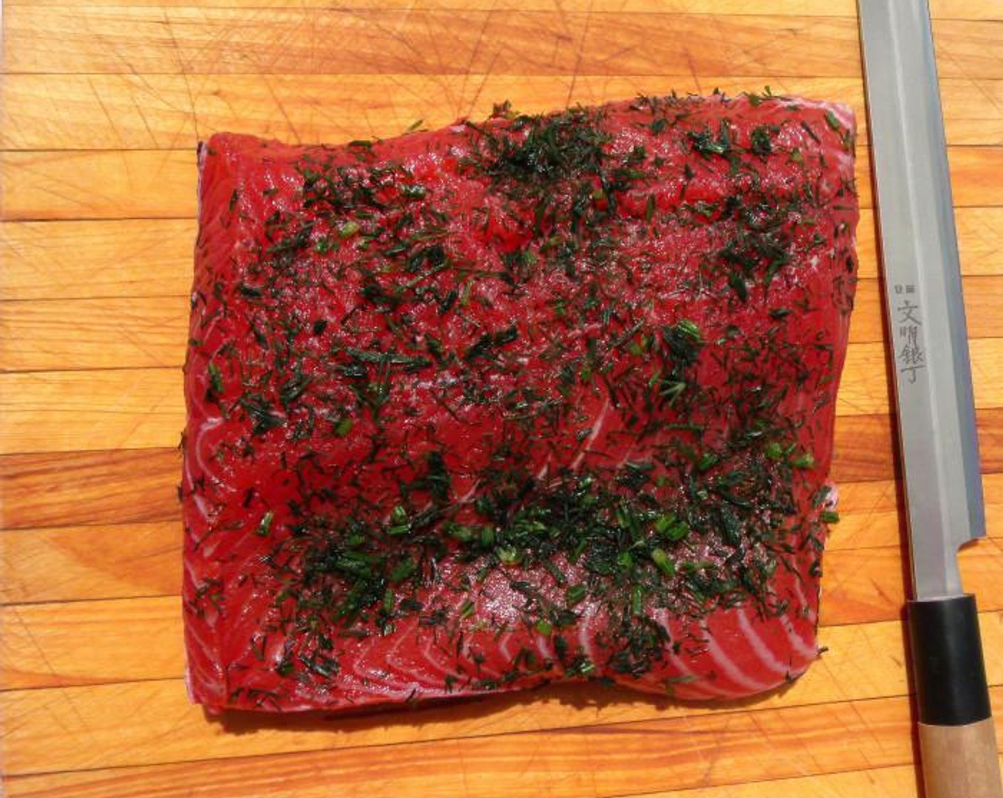 step 6 After 3 or 4 days, rinse the salmon under running water, pad dry, then cover flesh side with Fresh Dill (1/4 cup).