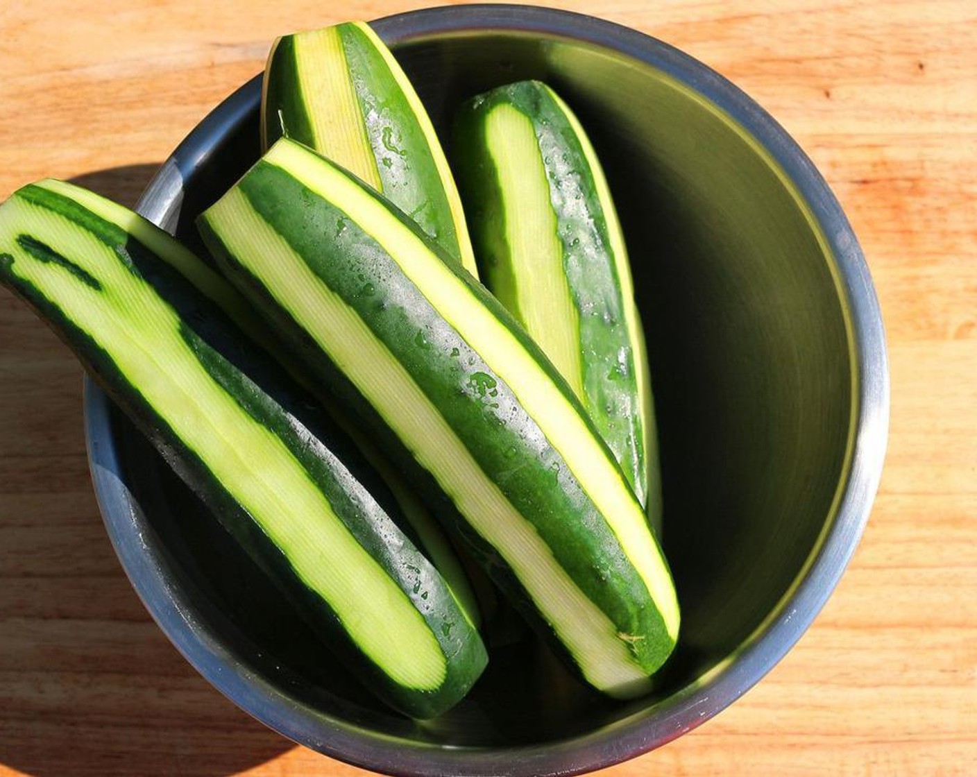 step 1 Peel Cucumbers (4) halfway.