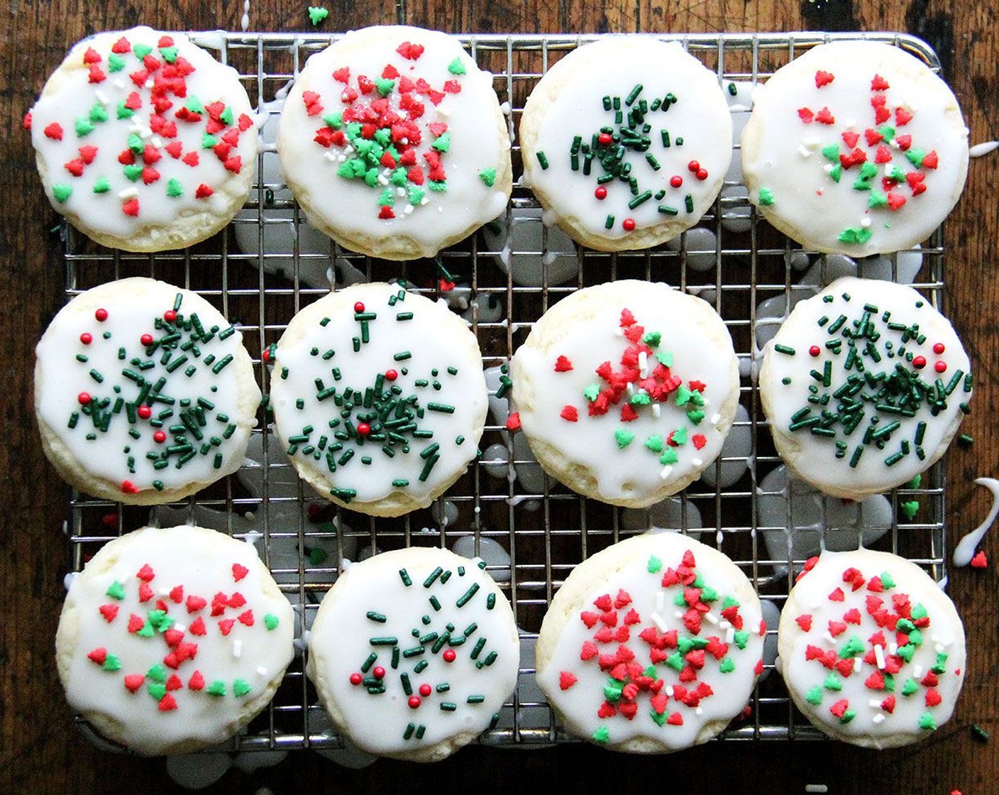 step 10 Meanwhile, stir together the Powdered Confectioners Sugar (1 cup) with Milk (1 Tbsp). You may add more milk a tablespoon at a time to achieve a thick but pourable consistency. Spoon icing onto the cookie, spreading to cover. Shower with Sprinkles (to taste). Enjoy!