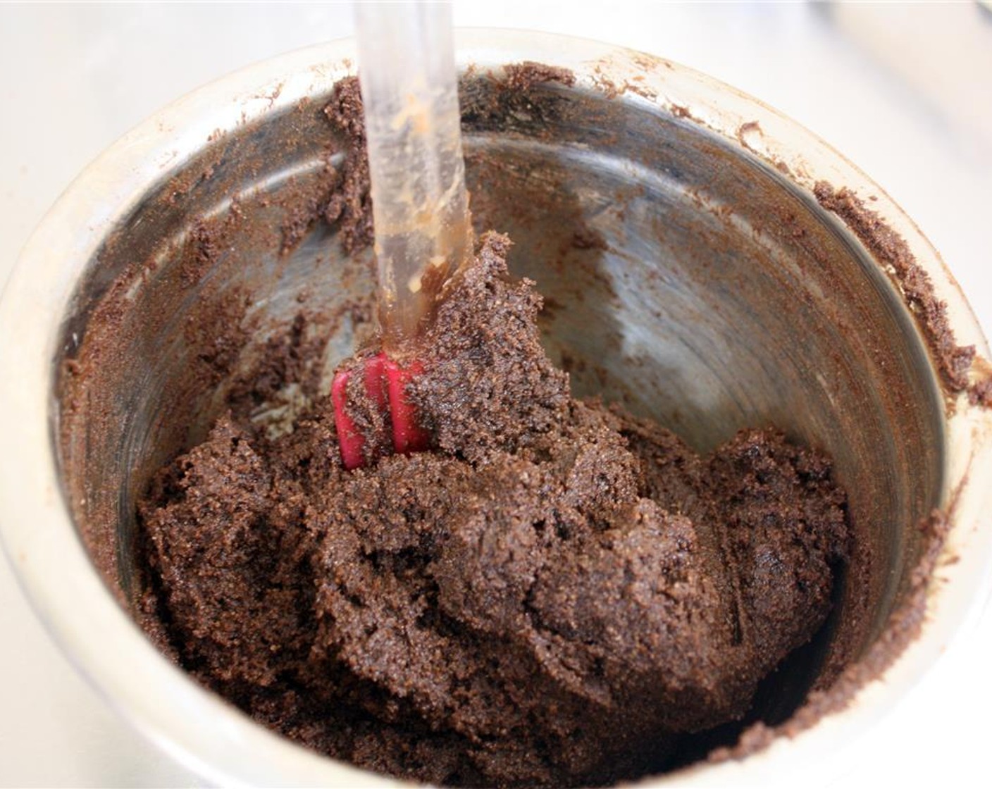 step 9 Pour the chocolate mixture into the bowl with the dry ingredients and mix well to combine. The batter will be very thick.