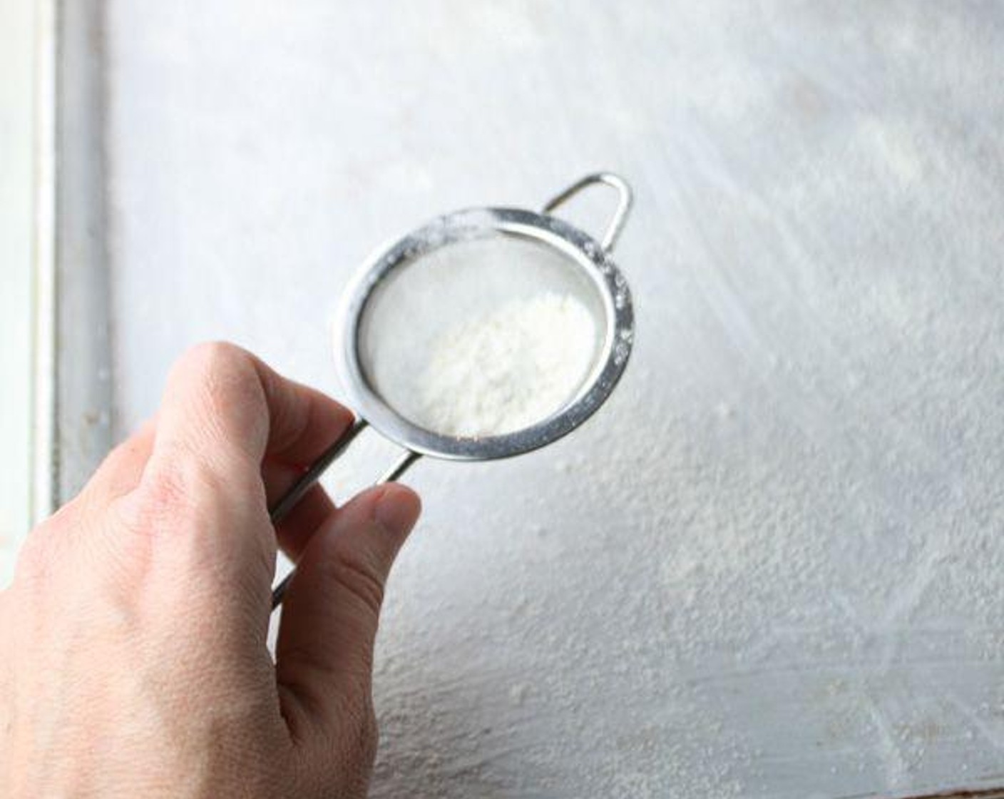 step 2 Grease a 13x18-inch half sheet pan; line with parchment paper. Grease and flour the parchment paper.