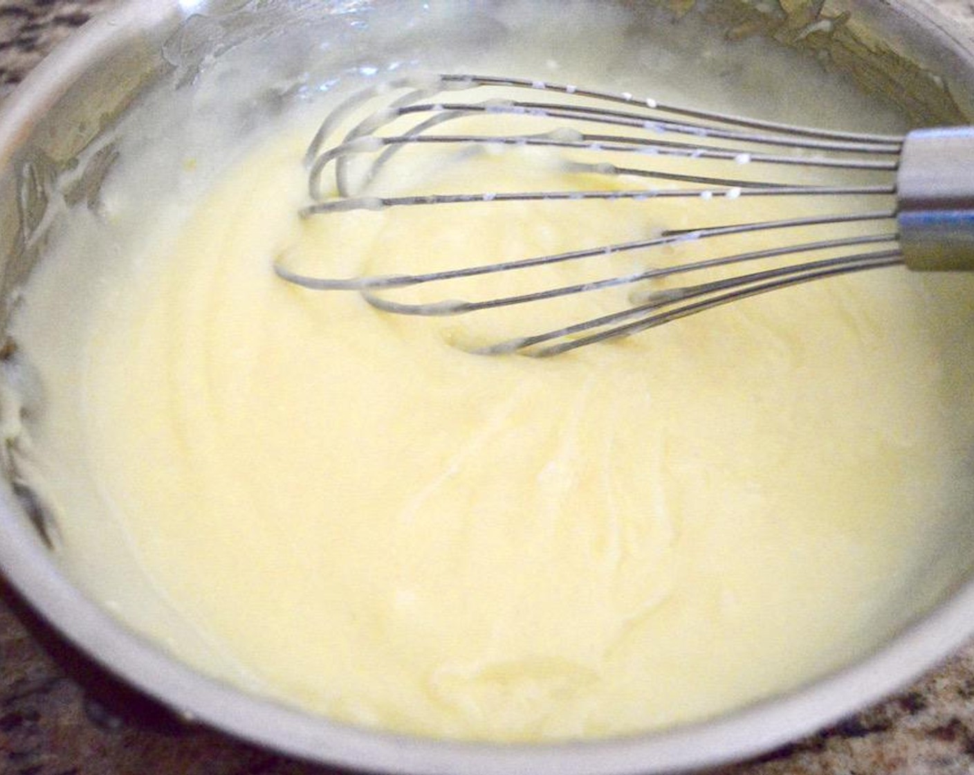 step 4 Let the pudding bubble and thicken for a minute while you keep whisking, then finally whisk in the Banana Extract (1/2 Tbsp) and Butter (1 Tbsp) until it is smooth. Transfer the pudding to a bowl and place plastic wrap directly on it to keep it from developing a skin. Set it in the refrigerator to chill for at least 2 hours.