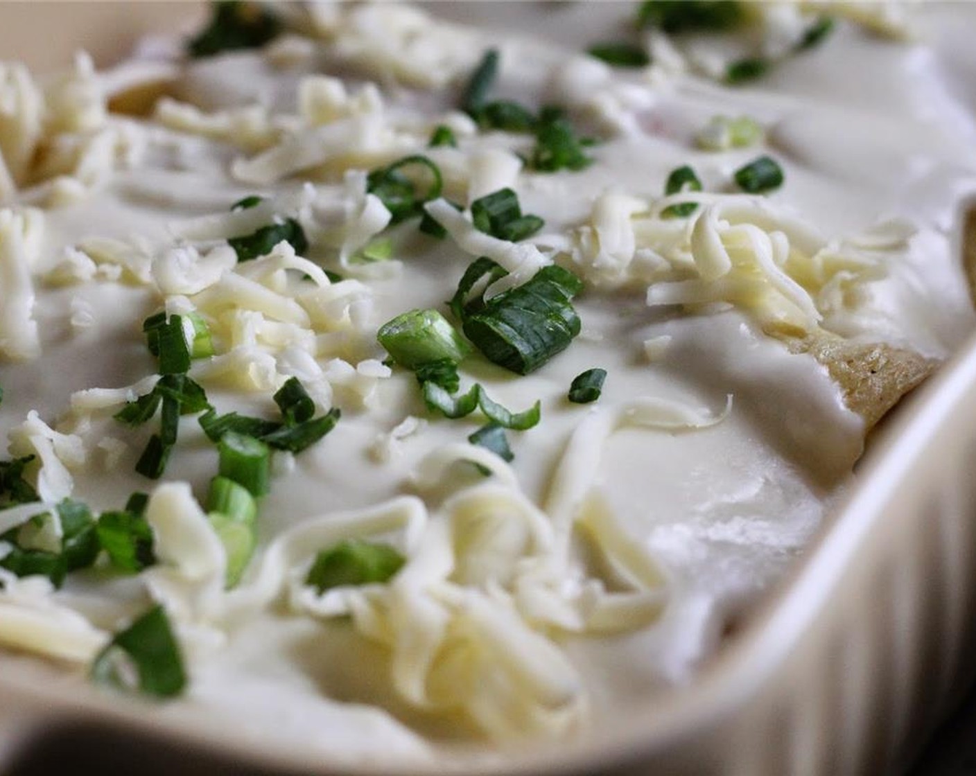 step 16 Pour the sauce over the crepes and sprinkle with Scallion (1 bunch). Bake for 30 minutes, or until bubbly and browning on top.