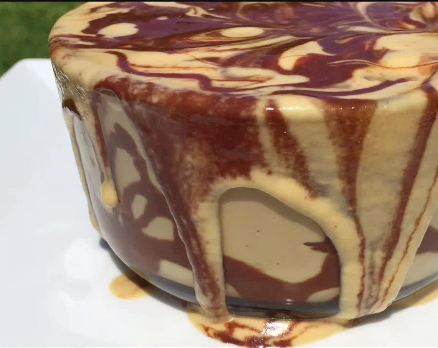 step 5 Sift Cacao Powder (1 tsp) on top, and garnish with remaining chocolate sauce. Serve immediately, or let chill for 30 minutes before serving. Enjoy!