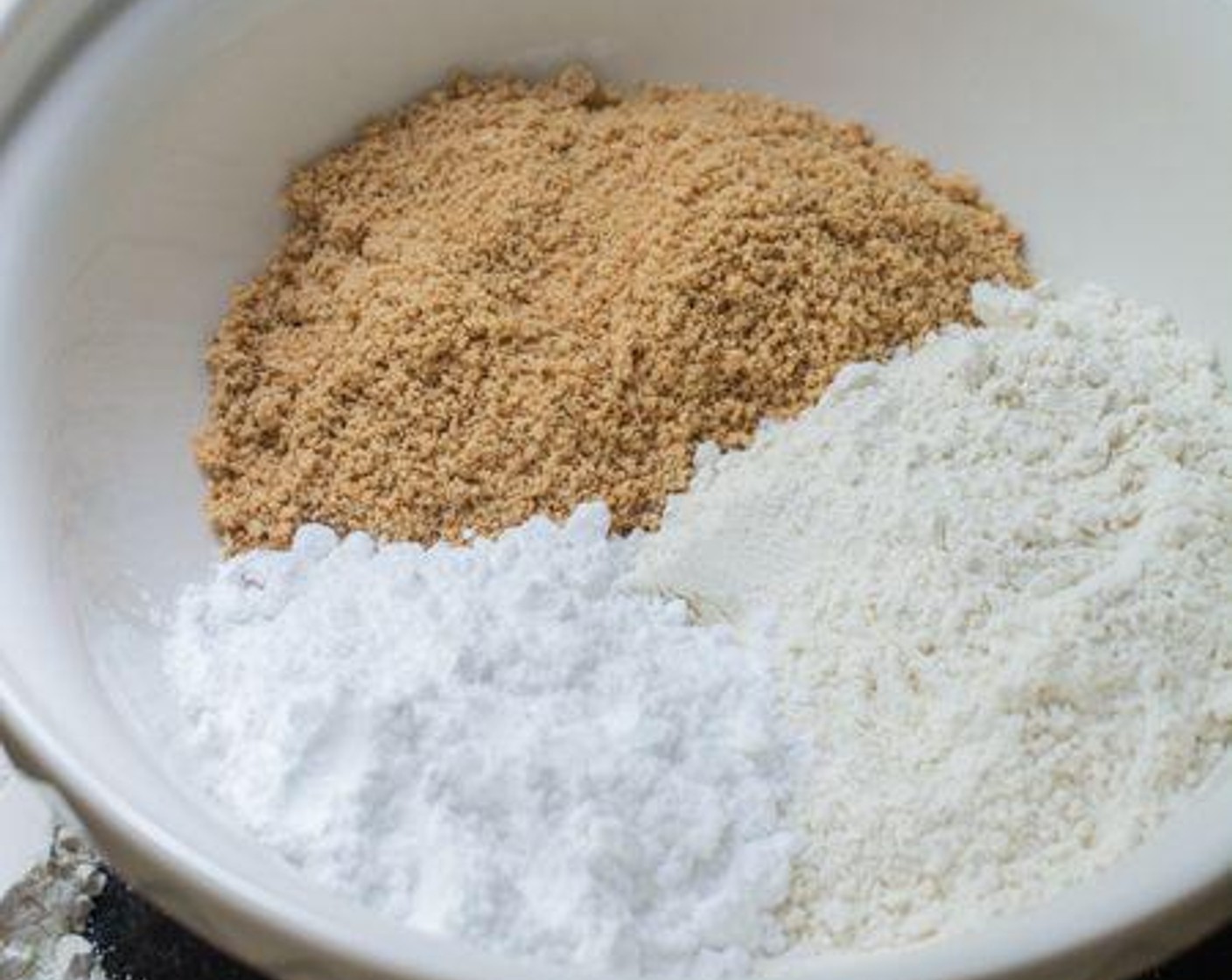 step 3 In a large mixing bowl, combine the ground peanuts, All-Purpose Flour (1 1/2 cups), Powdered Confectioners Sugar (1/2 cup), Granulated Sugar (1/2 cup) and Salt (1 pinch). Mix well.