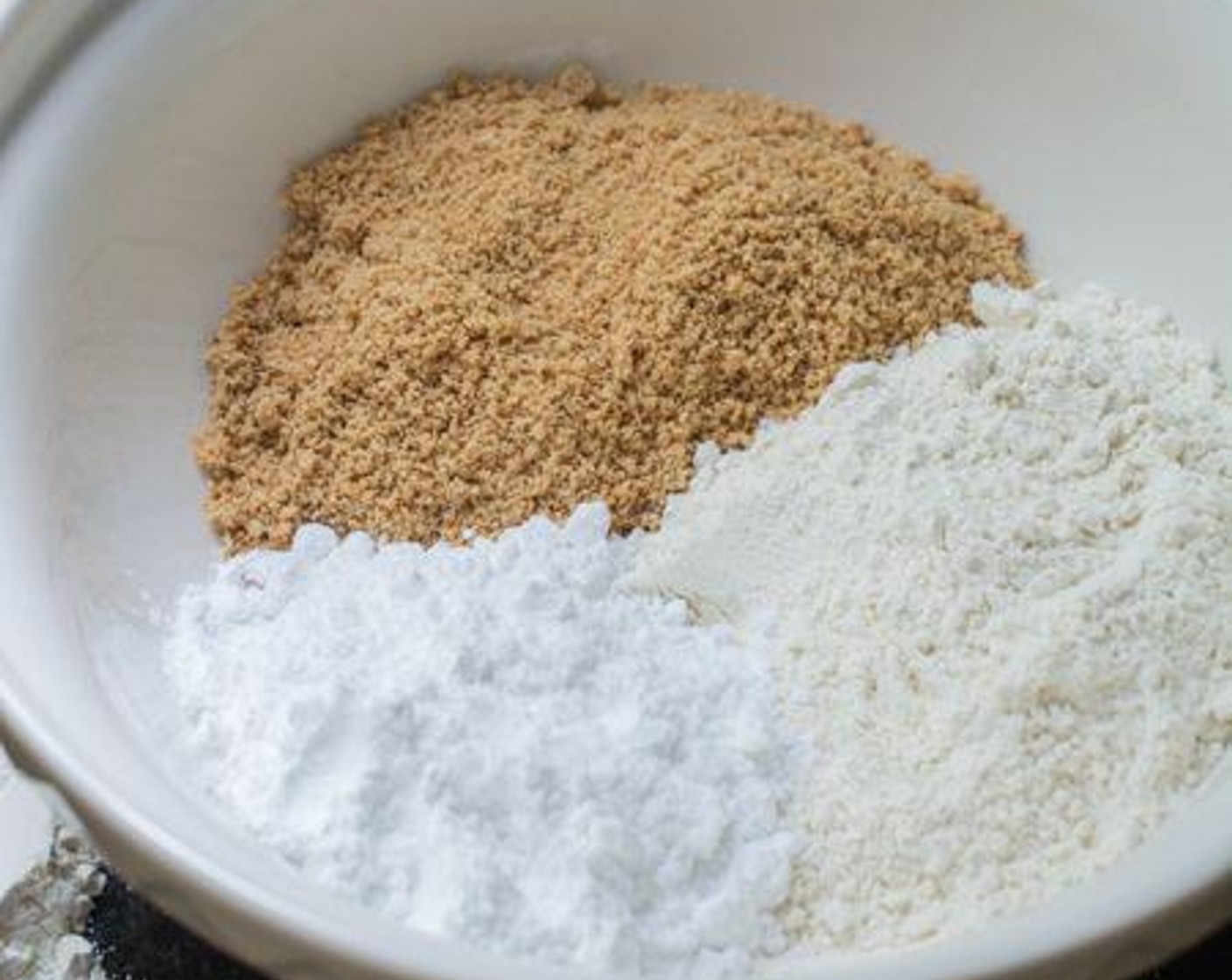step 3 In a large mixing bowl, combine the ground peanuts, All-Purpose Flour (185 g), Powdered Confectioners Sugar (55 g), Granulated Sugar (100 g) and Salt (1 pinch). Mix well.