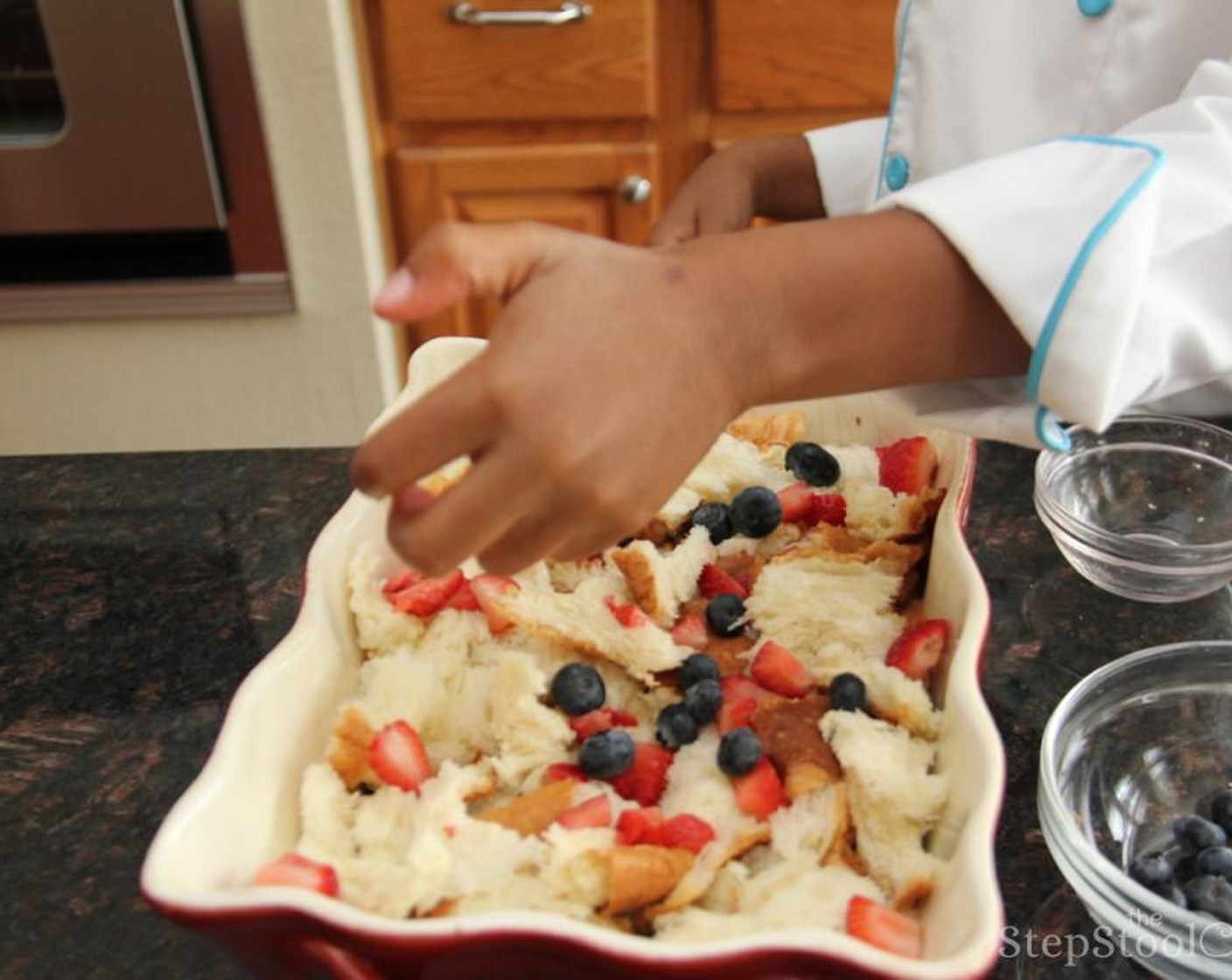 step 3 Tear Hawaiian Round Bread (1 pckg) into chunks and spread half of the bread evenly in the bottom of the dish. Add about half of the Fresh Blueberry (1/2 cup) and strawberries. Add remaining bread on top and then berries.