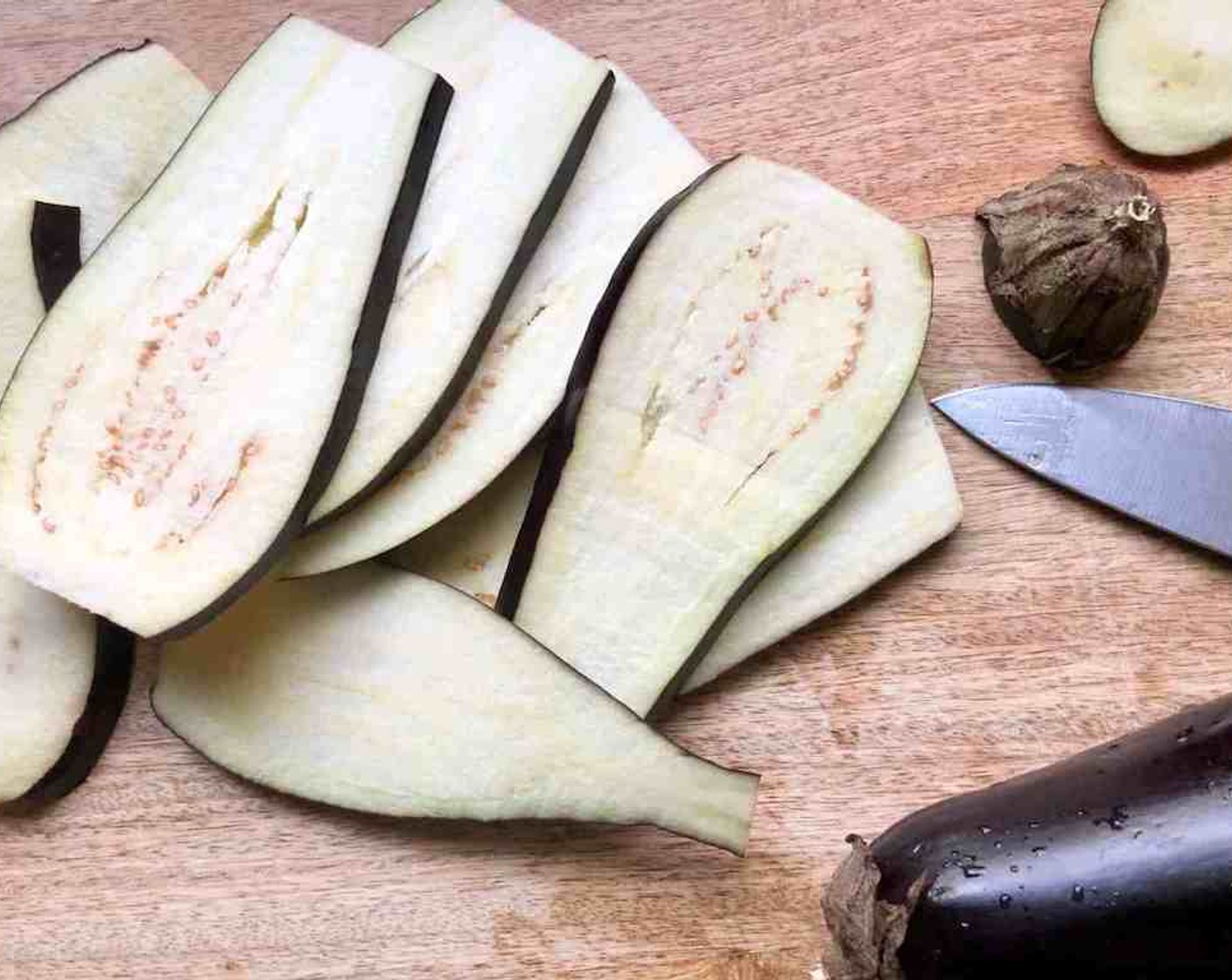 step 2 Slice the Eggplants (2) lengthwise into 1/8 to 1/4-inch thick slices. Sprinkle both sides generously with Kosher Salt (to taste) then arrange the eggplant slices in a single layer between several layers of paper towels.