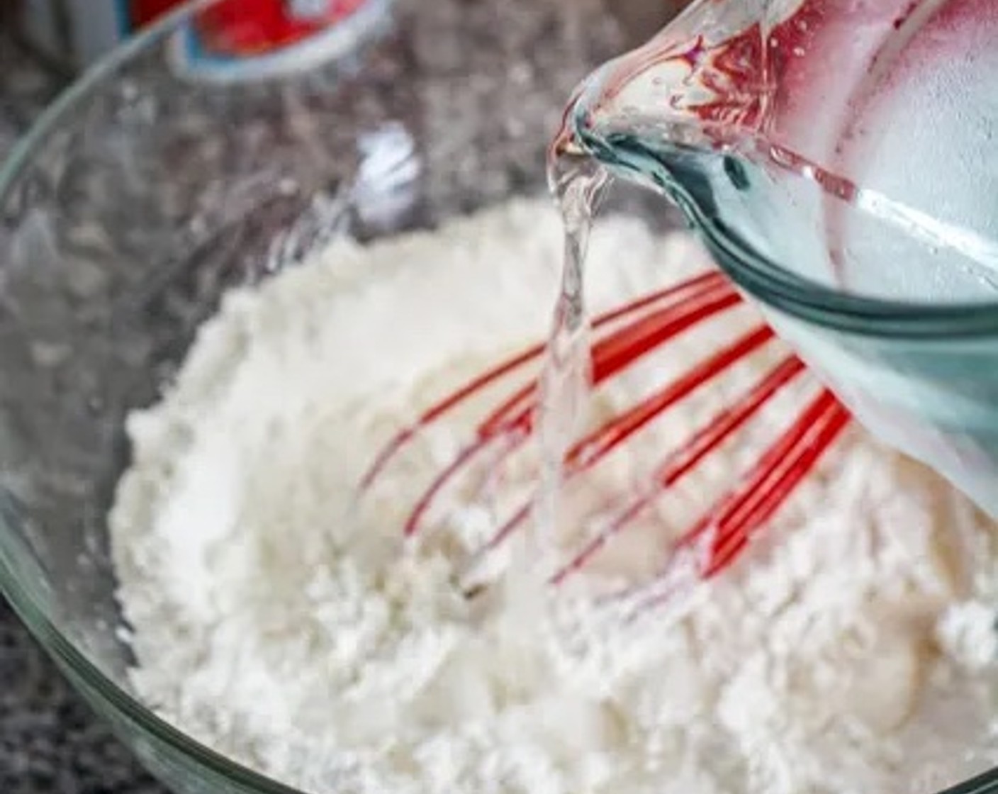 step 2 Slowly drizzle the Water (1/2 cup) into the dry ingredients, about 1 Tbsp at a time, while whisking until you get the consistency of pancake batter.