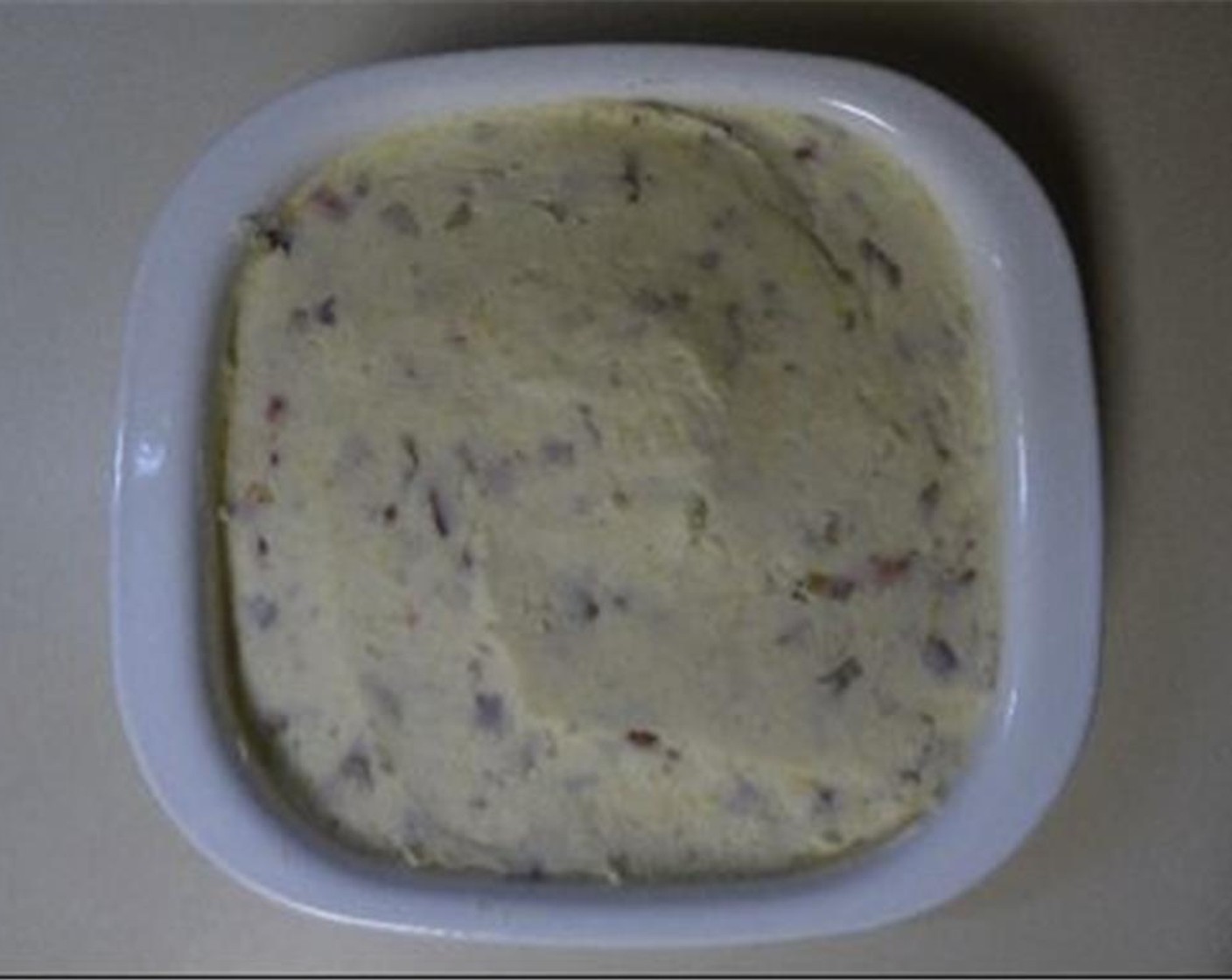 step 7 Add block of cream cheese, Butter (4 Tbsp), Sour Cream (1 cup), Heavy Cream (4 Tbsp), and Ground Black Pepper (1/2 tsp)/ Mix until you remove any lumps or until desired consistency. Fold in half the Shredded Sharp Cheddar Cheese (2 cups) and all of the bacon (don't completely mix in the cheese).