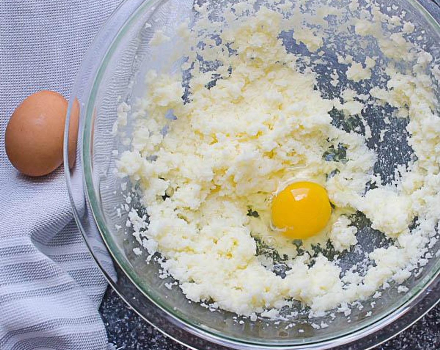 step 4 In a large bowl beat together the Granulated Sugar (1 cup) and Butter (1/2 cup) for 1 to 2 minutes on medium-high speed until fluffy and well incorporated. Beat the Eggland's Best Classic Eggs (2) in one at a time, scraping the sides of the bowl with a spatula occasionally.