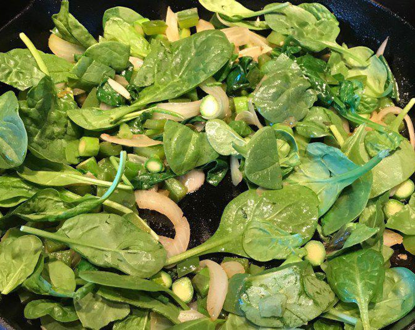 step 4 Add Asparagus (4), Scallion (1 bunch), Fresh Baby Spinach (4 cups) and continue to sauté over medium-low heat, for about 5 minutes. When the spinach is wilted, remove half of the vegetable mixture to a bowl and reserve.