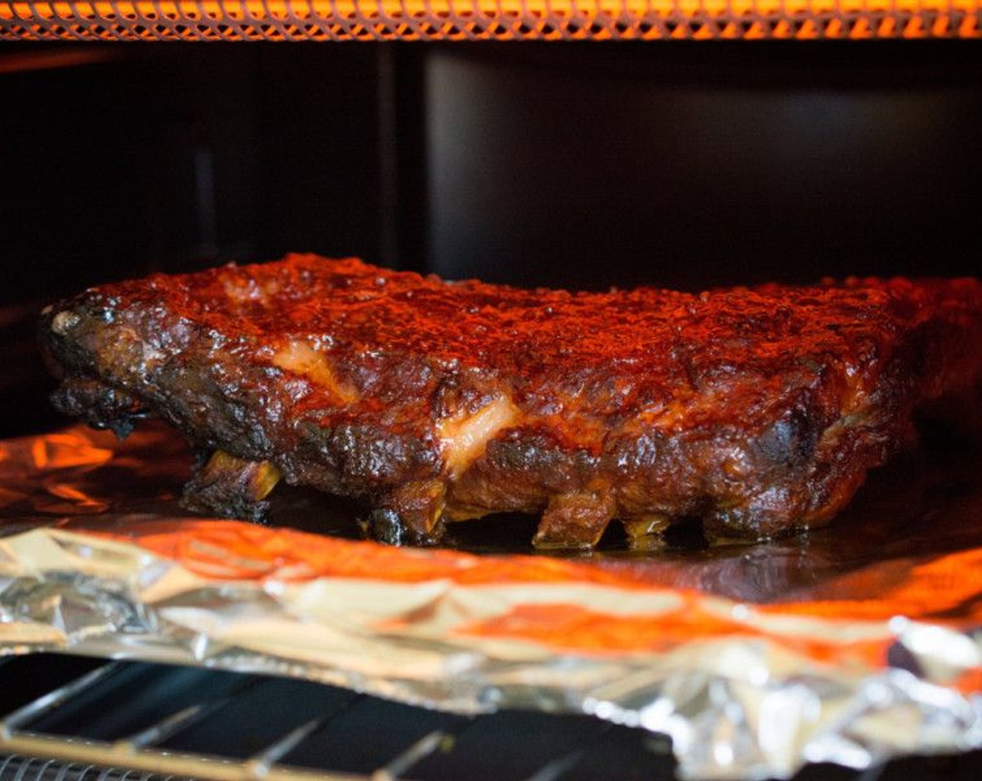 step 10 Baste a little bit more BBQ sauce on the top of the ribs.